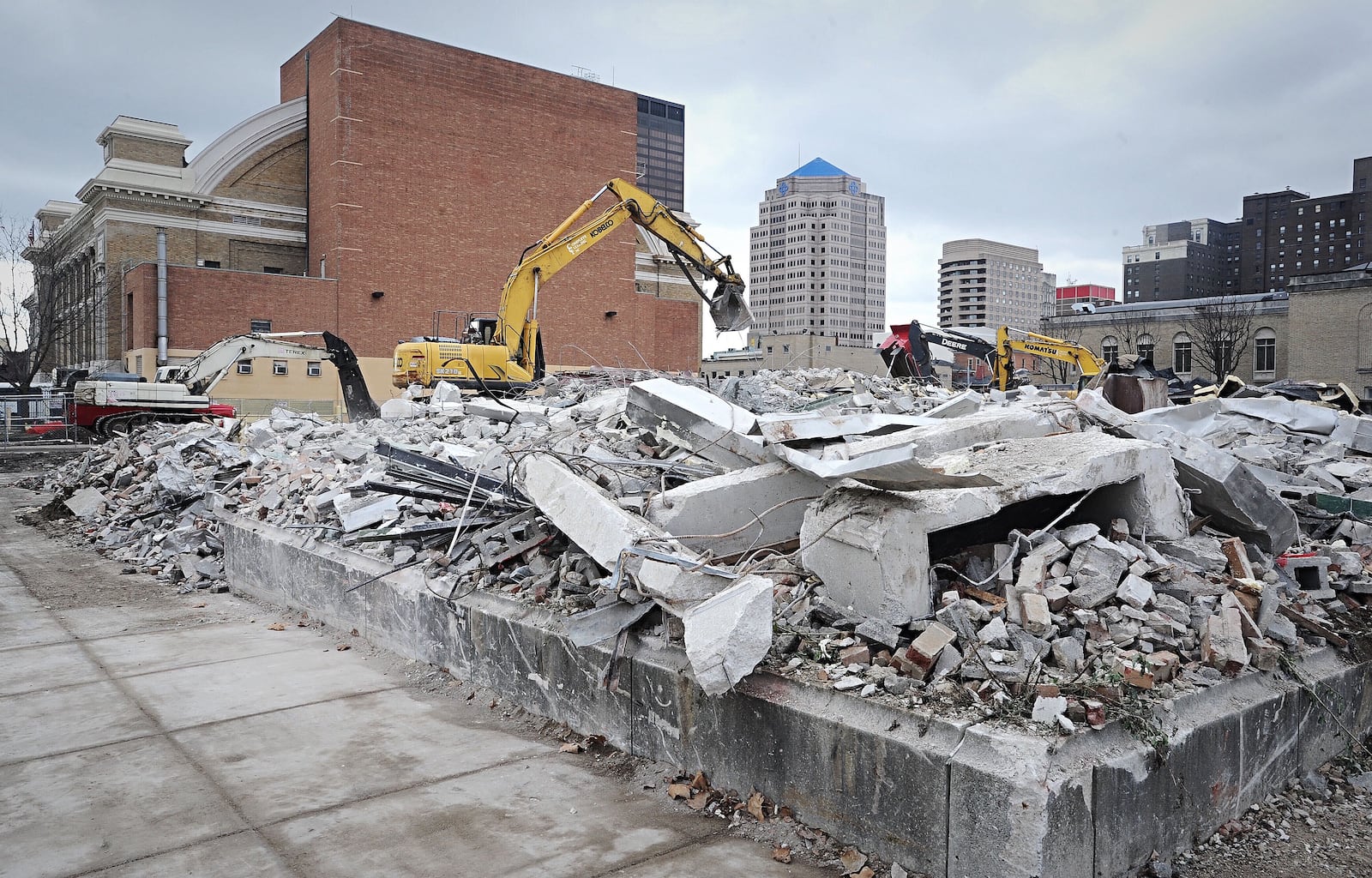 The old Wright State Kettering Center at the corner on St. Clair and Monument, collapsed Monday knocking down RTA lines and damaging a sculpture across Monument Ave. in the Riverscape Metro Park. No one was injured. The building was being removed by a demo crew. MARSHALL GORBY\STAFF