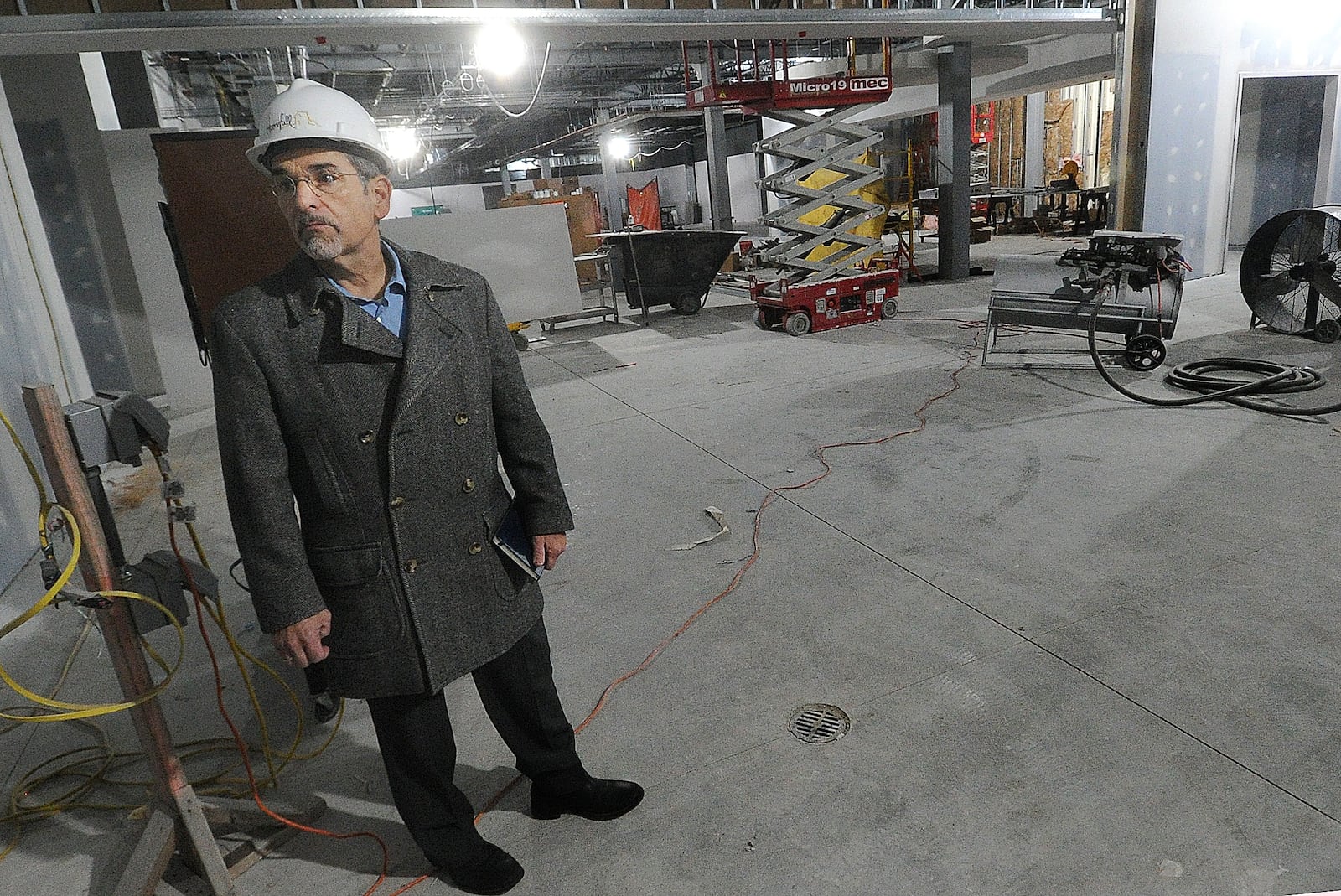 John Fabelo, LWC, Director of Design, talks about progress on Homefull’s new West Dayton grocery store on South Gettysburg Ave. Friday, Feb. 16, 2024.  The 16-arce development will include a Kettering Health primary care practice for all ages and the Ziks Family Pharmacy with medicine and health-related items. MARSHALL GORBY\STAFF