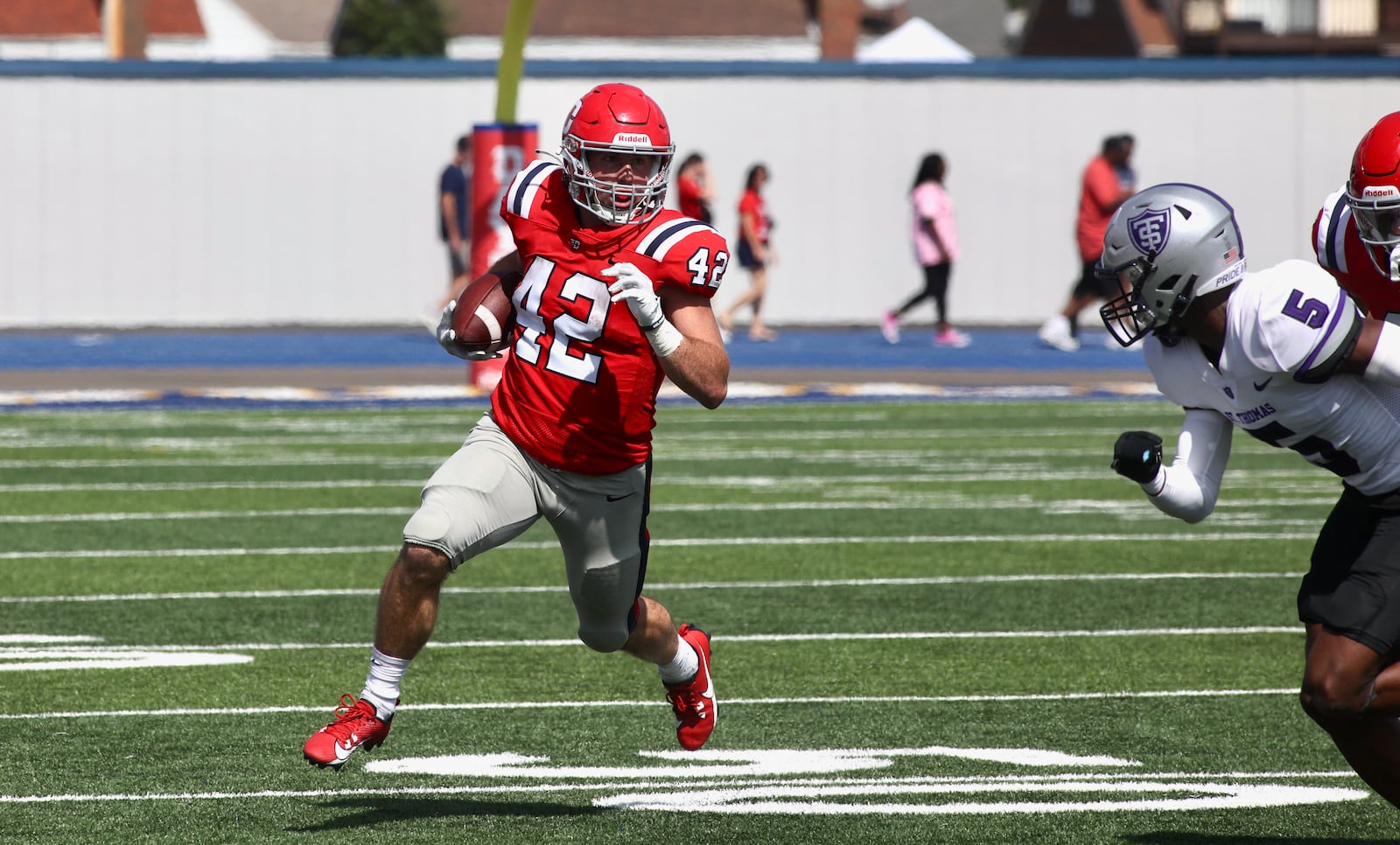 Dayton's Gavin Lochow runs after a catch against St. Thomas on Saturday, Sept. 30, 2023, at Welcome Stadium. David Jablonski/Staff