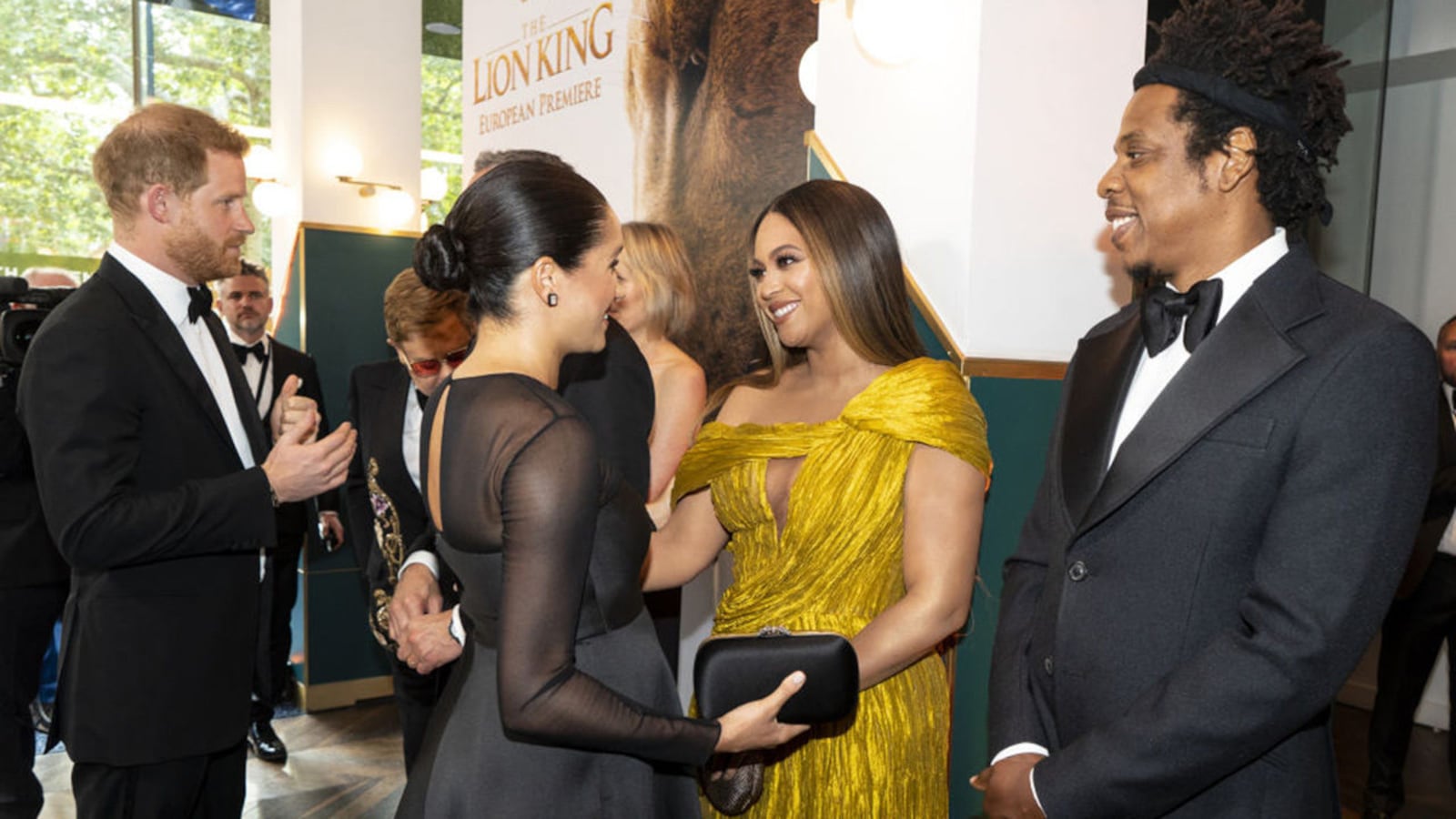 Prince Harry, Duke of Sussex (L) and Meghan, Duchess of Sussex (2nd L) meets cast and crew, including Beyonce Knowles-Carter (C) Jay-Z (R) as they attend the European Premiere of Disney's "The Lion King."