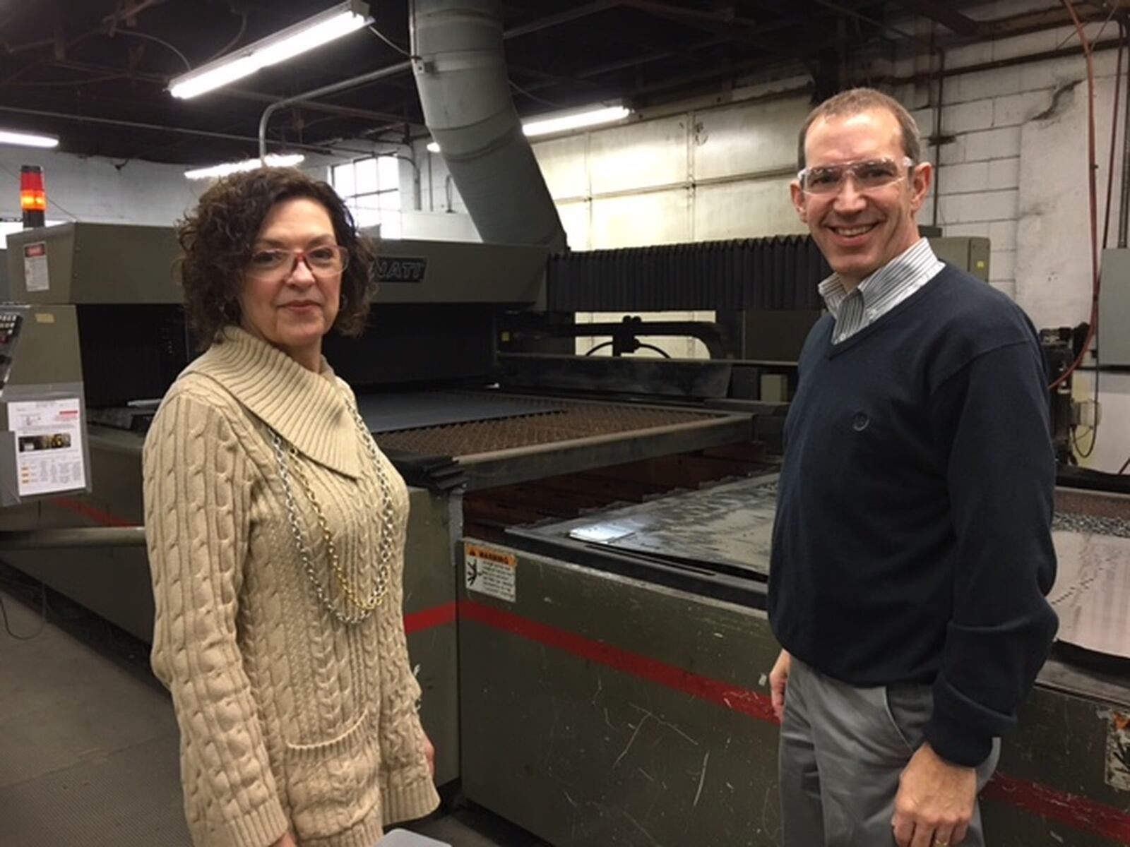 Angelia Erbaugh, president of the Dayton Region Manufacturers Association, and Jim Bowman, chief operating officer at Moraine’s Rack Processing Co. Inc., in 2017. THOMAS GNAU/STAFF