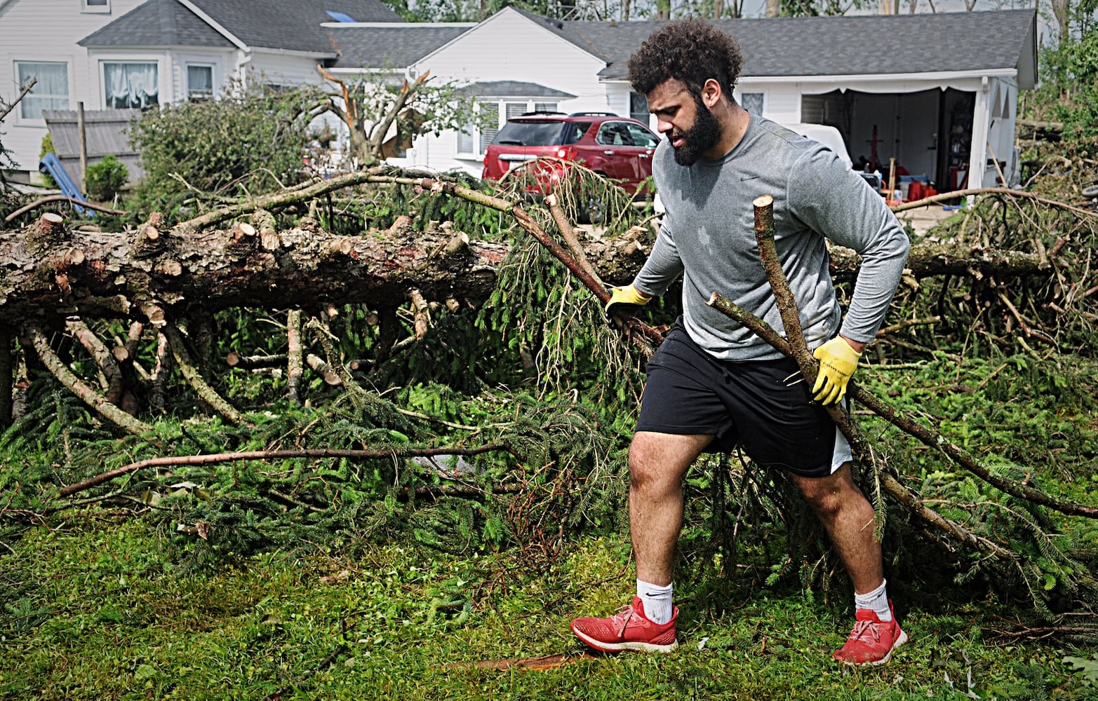 PHOTOS: Tornado-damaged communities dig out, clean up