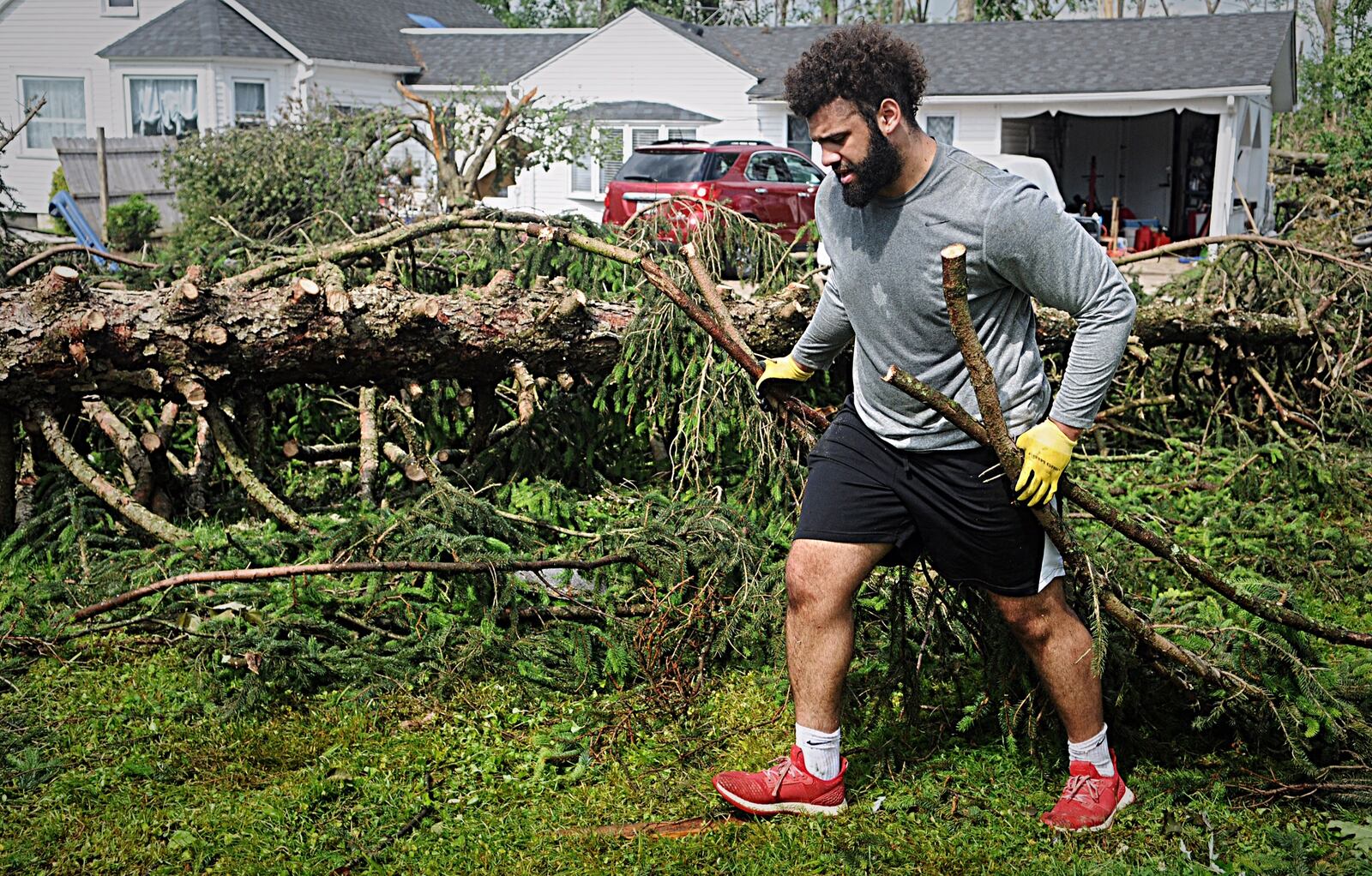 Miami football helps with cleanup of Beavercreek on Friday