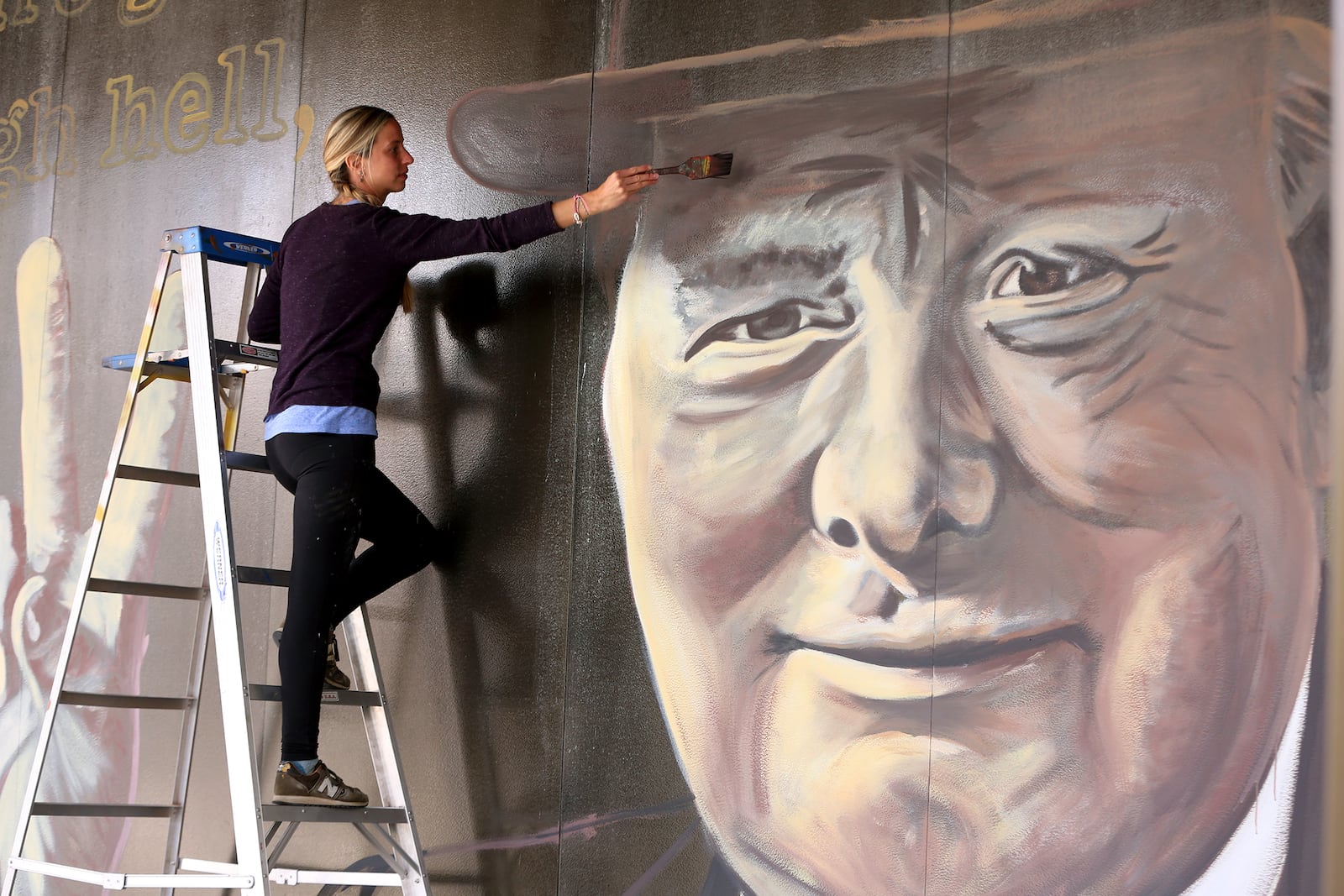 Winston Churchill, prime minister of Great Britain during much of World War II, is the subject of the latest downtown Dayton mural on the Stratacache Tower. The image of Churchill, painted by mural artist Erica Arndts, is accompanied by a quote he is associated with, âIf you are going through hell, keep going.â LISA POWELL / STAFF