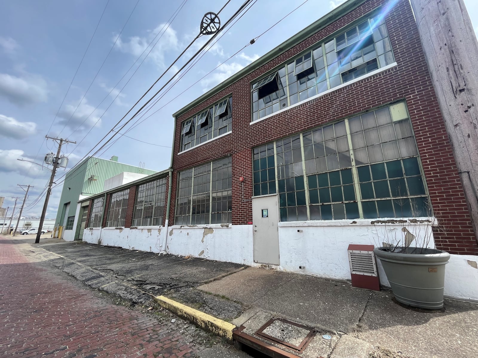 The Midwest Tool & Engineering Co. building in the Webster Station neighborhood in downtown Dayton. Windsor Companies plans to tear down the structure to make way for a new, five-story apartment building. CORNELIUS FROLIK / STAFF