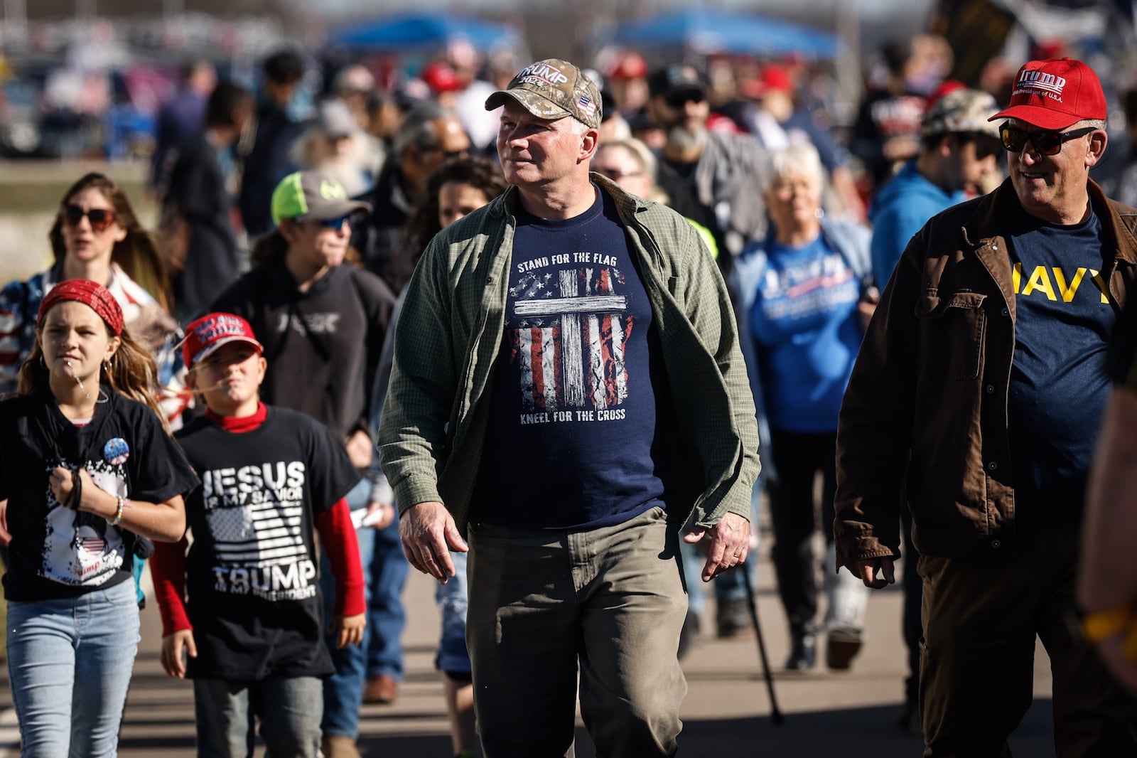 Hundreds of former President Trump fans walk the line of merchandise Monday, Nov. 7, 2022, at the Dayton International Airport in Dayton. JIM NOELKER/STAFF