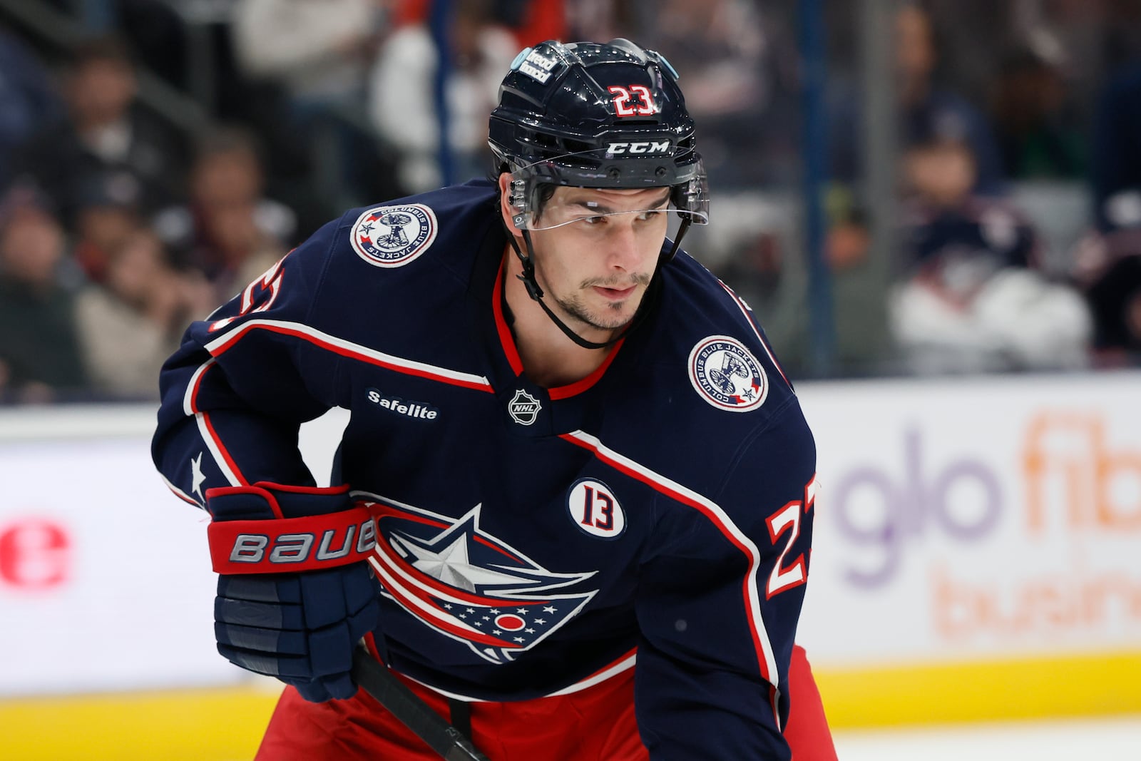 Columbus Blue Jackets players, including Sean Monahan wear helmet stickers and patches honoring Johnny Gaudreau and his brother Matthew during the first period of an NHL hockey game against the Florida Panthers Tuesday, Oct. 15, 2024, in Columbus, Ohio. All teams in the NHL will wear helmet stickers honoring the Gaudreau brothers. (AP Photo/Jay LaPrete)