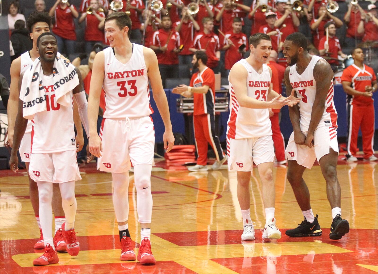 Dayton players celebrate after a victory against Richmond on Sunday, Jan. 6, 2019, at UD Arena.