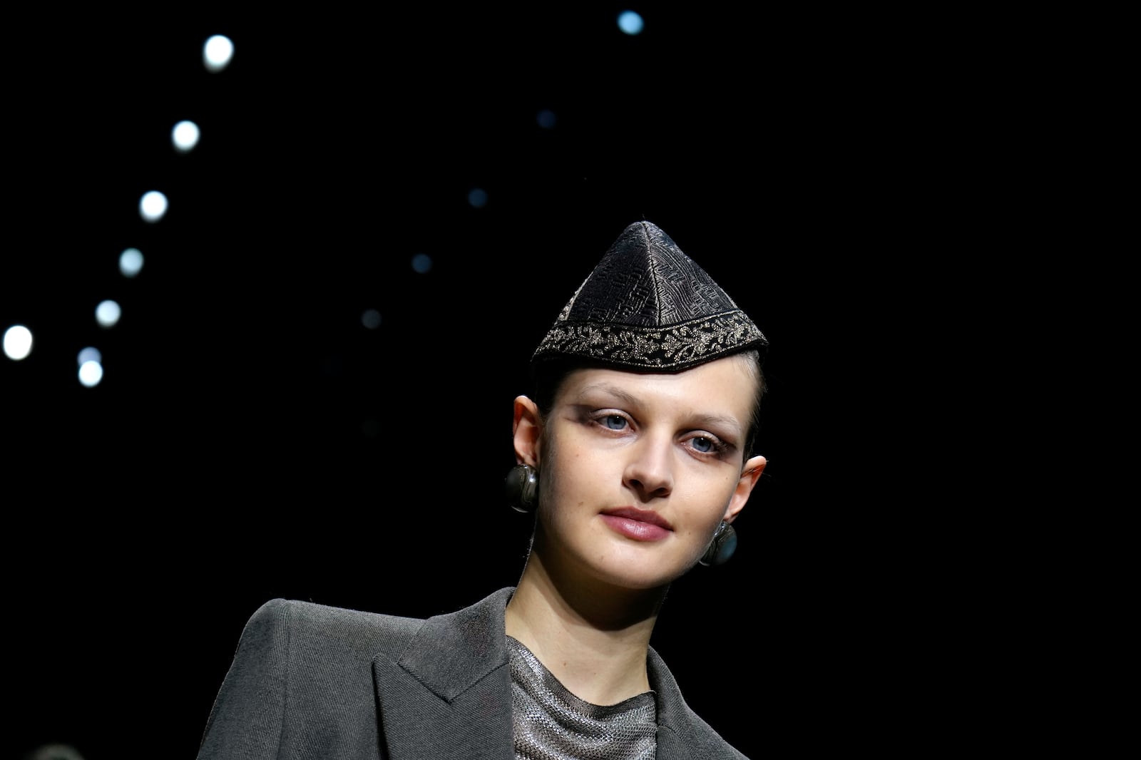 A model wears a creation as part of the Giorgio Armani Fall/Winter 2025-2026 Women's collection presented in Milan, Italy, Sunday, March 2, 2025. (AP Photo/Luca Bruno)