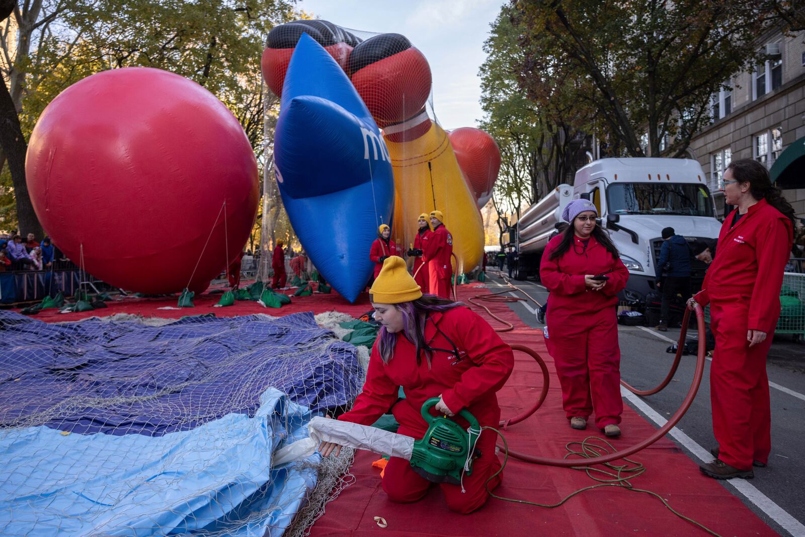 A person inflates a float of Bluey in preparation for the Macy's Thanksgiving Day Parade, Wednesday, Nov. 27, 2024, in New York. (AP Photo/Yuki Iwamura)