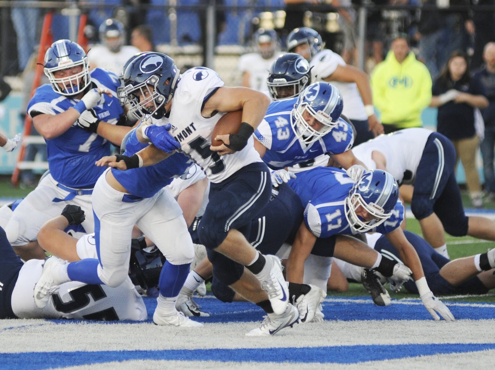 Fairmont’s Jesse Deglow is pursued by Miamisburg’s Cael Parkhurst (43), Dylan Wudke (17) and others. Fairmont defeated host Miamisburg 25-24 in a Week 6 high school football game on Friday, Sept. 28, 2018. MARC PENDLETON / STAFF