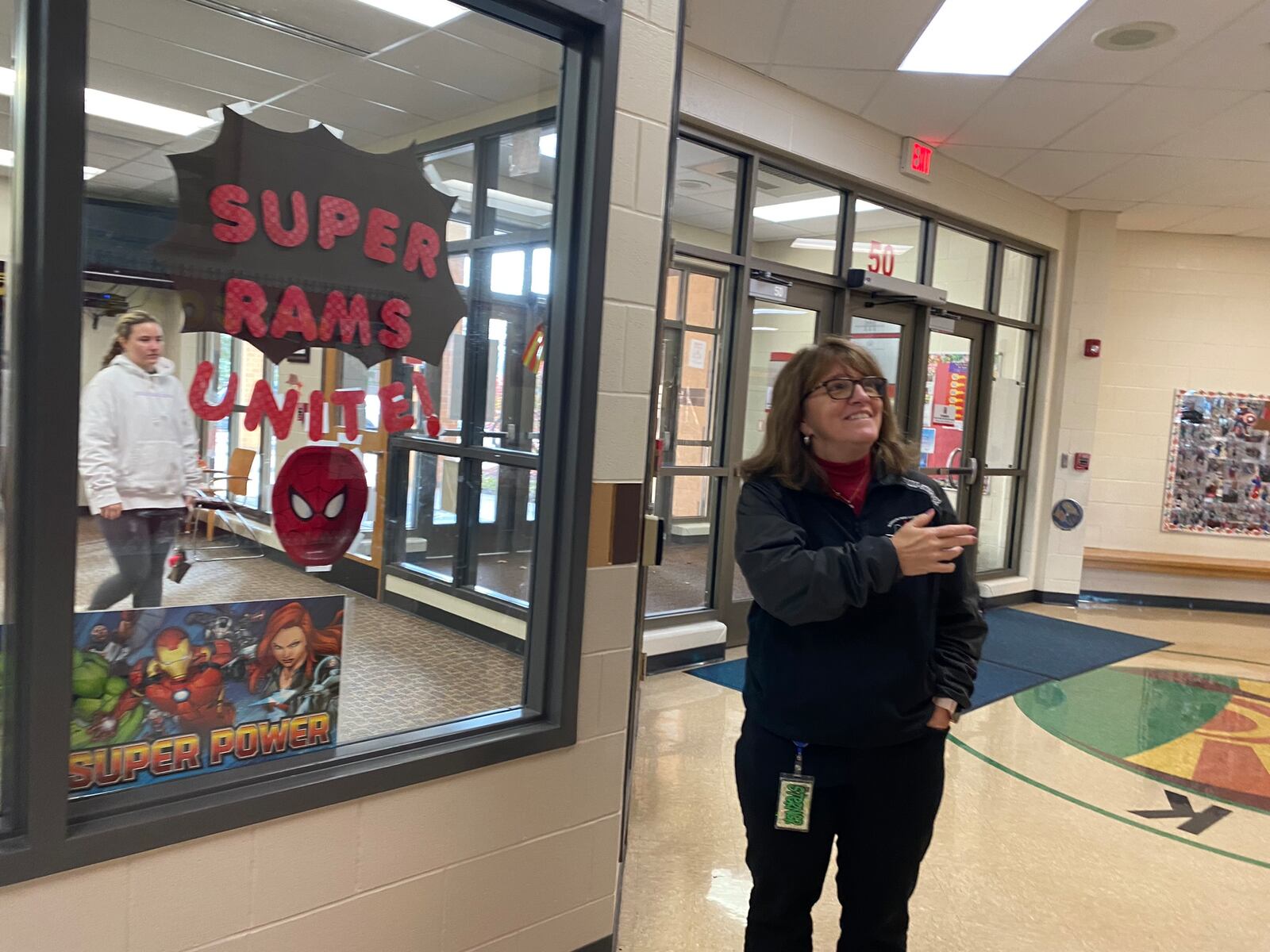 Tamara Rizzo-Sterner, principal of Madison Park Elementary, a 2-3 elementary school in Trotwood, looks at a painting of the school from when it was built. Eileen McClory/ staff