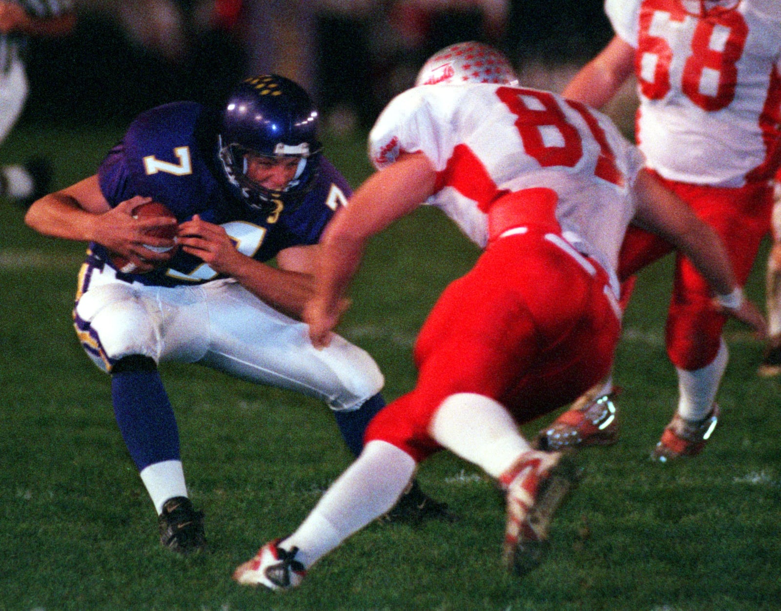 #7 JOSH BETTS OF VANDALIA-BUTLER TRIES TO AVOID BEING SACKED BY #81 KRIS DIELMAN OF TROY. DDN file.