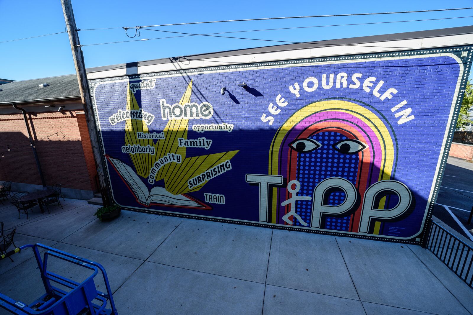 The new "See Yourself in Tipp" mural on the wall of the Tipp City Public Library facing the Coldwater Café at their shared alley outdoor patio space on October 31, 2020, shortly after its completion. TOM GILLIAM