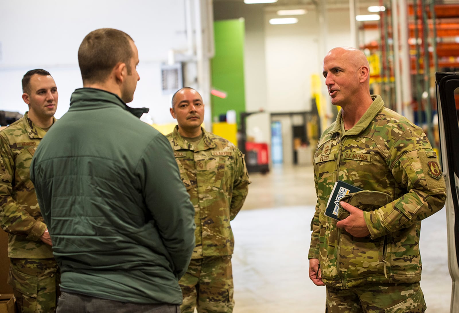 Chief Master Sgt. David Flosi, Air Force Materiel Command command chief, and Kevan Dilworth, 88th Air Base Wing Base Plans and Programs Division mission operations specialist, discuss the capabilities of the Android Tactical Assault Kit (ATAK), Mar. 10, 2022, during a visit to Wright-Patterson Air Force Base, Ohio.  ATAK and similar common operating picture technology enhance command and control of emergency situations and allow for multi-agency integration. (U.S. Air Force photo by Jaima Fogg)