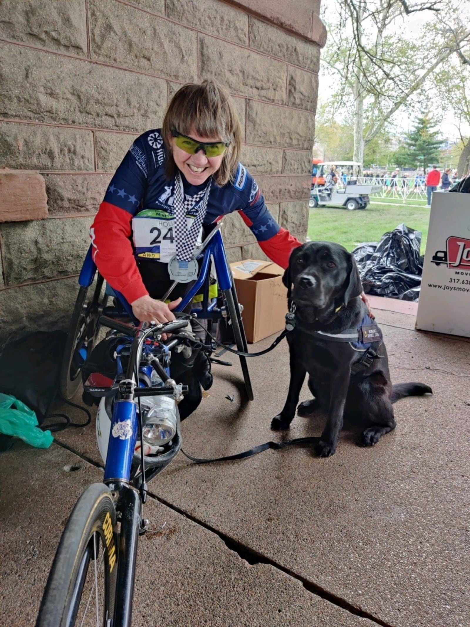 Holly Koester and her service dog Flare after the Indy 500 half marathon. CONTRIBUTED