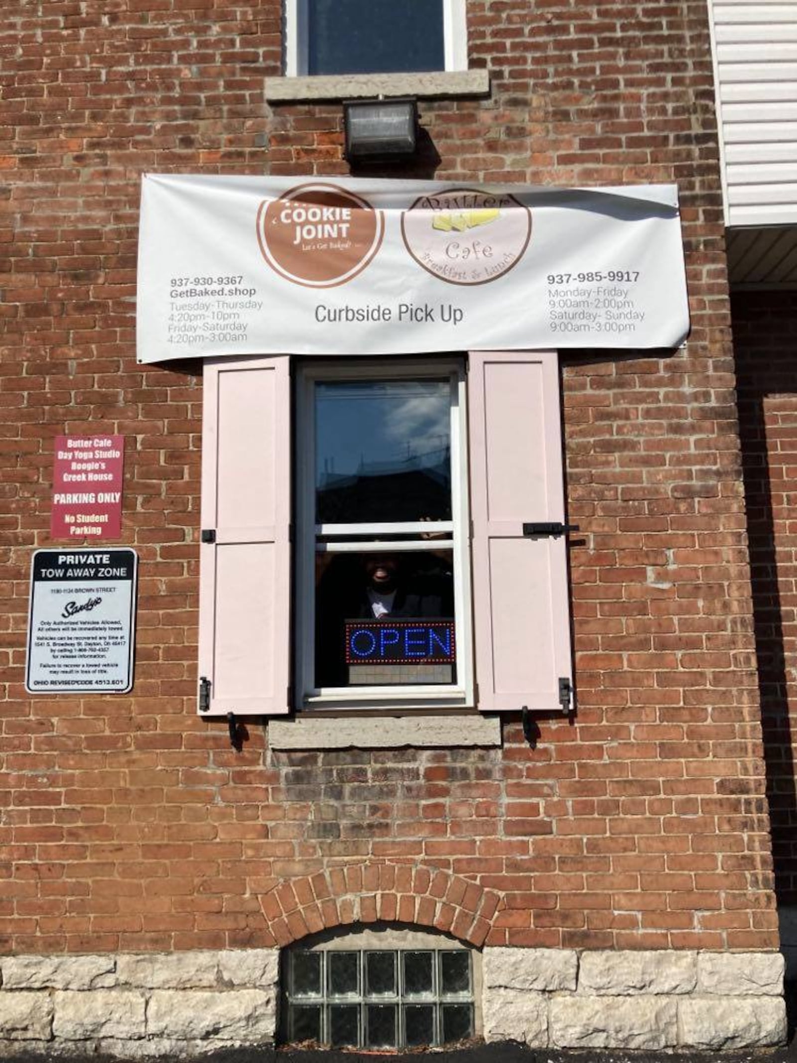 Isiah Davis bakes inside Butter Cafe on Brown St. in Dayton, and serves the cookies, fresh-baked and still hot, from the restaurant's carryout window.