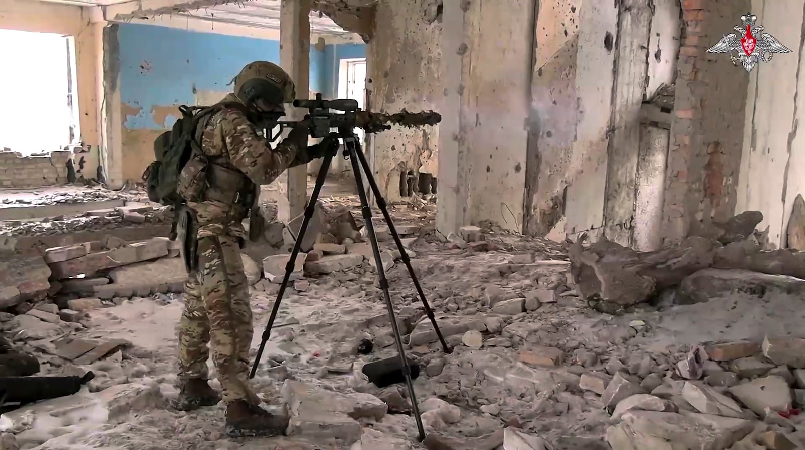 In this photo taken from video distributed by Russian Defense Ministry Press Service on Wednesday, Feb. 26, 2025, A Russian Army sniper fires toward Ukrainian position at an undisclosed location in Ukraine. (Russian Defense Ministry Press Service via AP)