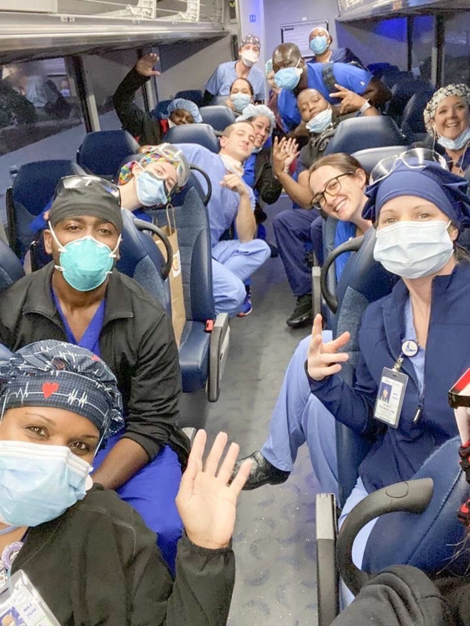 Dayton nurse Stacy Thomas is working in New York as part of the battle against coronavirus.  She is pictured with other health care workers on the bus to Jacobi Medical Center.