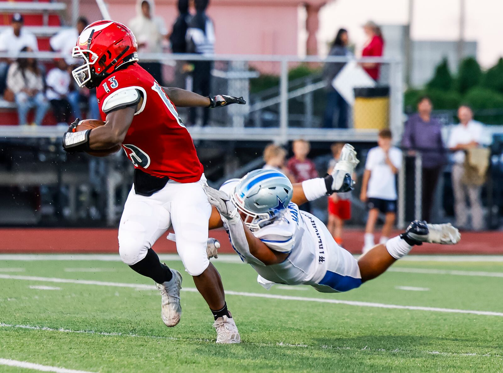 Hamilton's Trey Verdon tries to tackle Princeton's Jordan Fitzpatrick during their football game Friday, Sept. 15, 2023 at Princeton. Princeton won 22-16. NICK GRAHAM/STAFF 