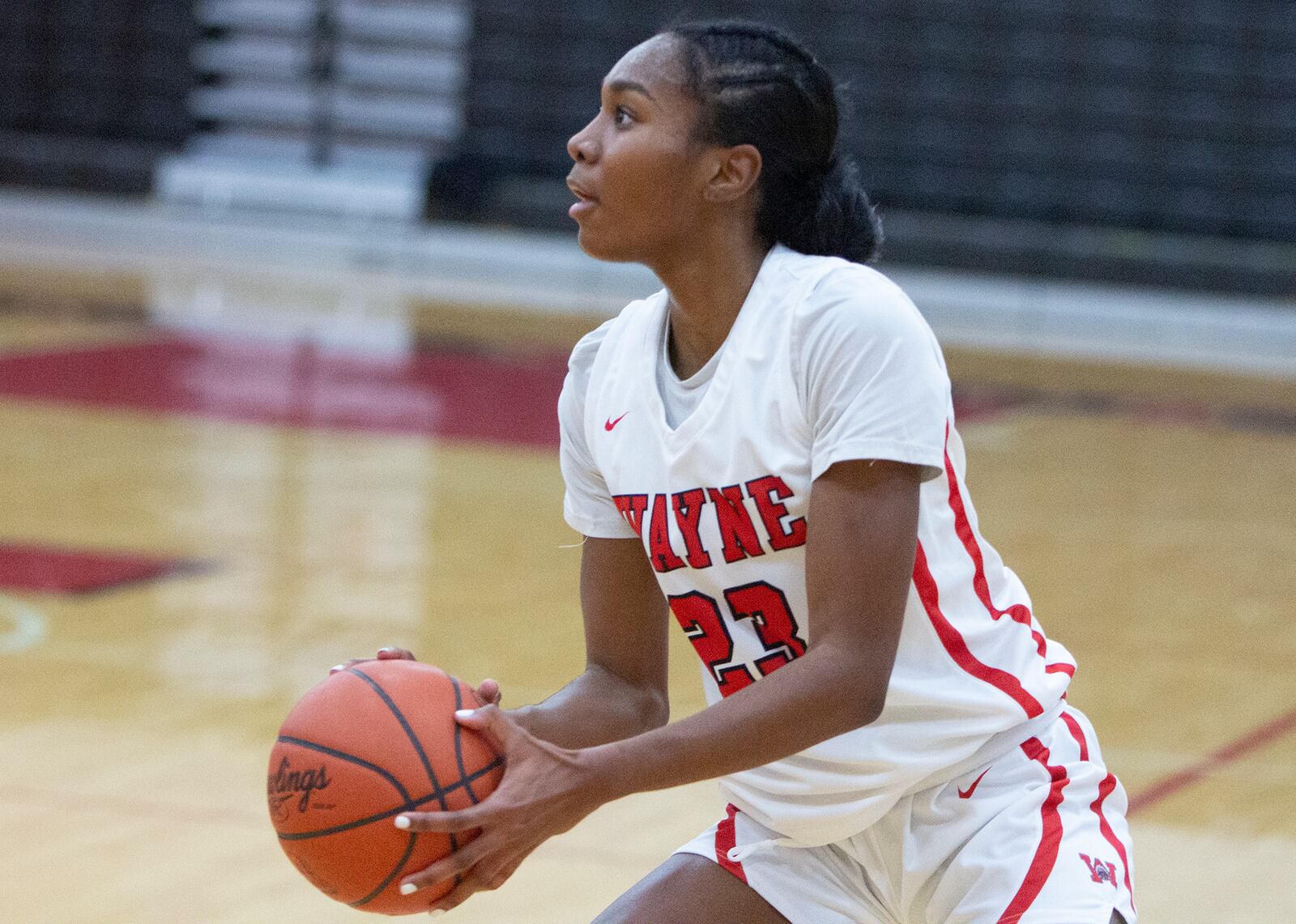 Wayne senior Bree Hall sets up for a shot during the first half of the Warriors' 66-64 loss at home to Centerville on Thursday night. Hall scored a game-high 29 points. Jeff Gilbert/CONTRIBUTED