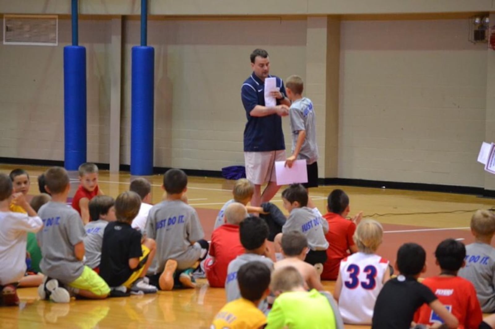 Jacob Conner getting Camper of the Week from then head coach Archie Miller at Flyers camp a decade ago. CONTRIBUTED