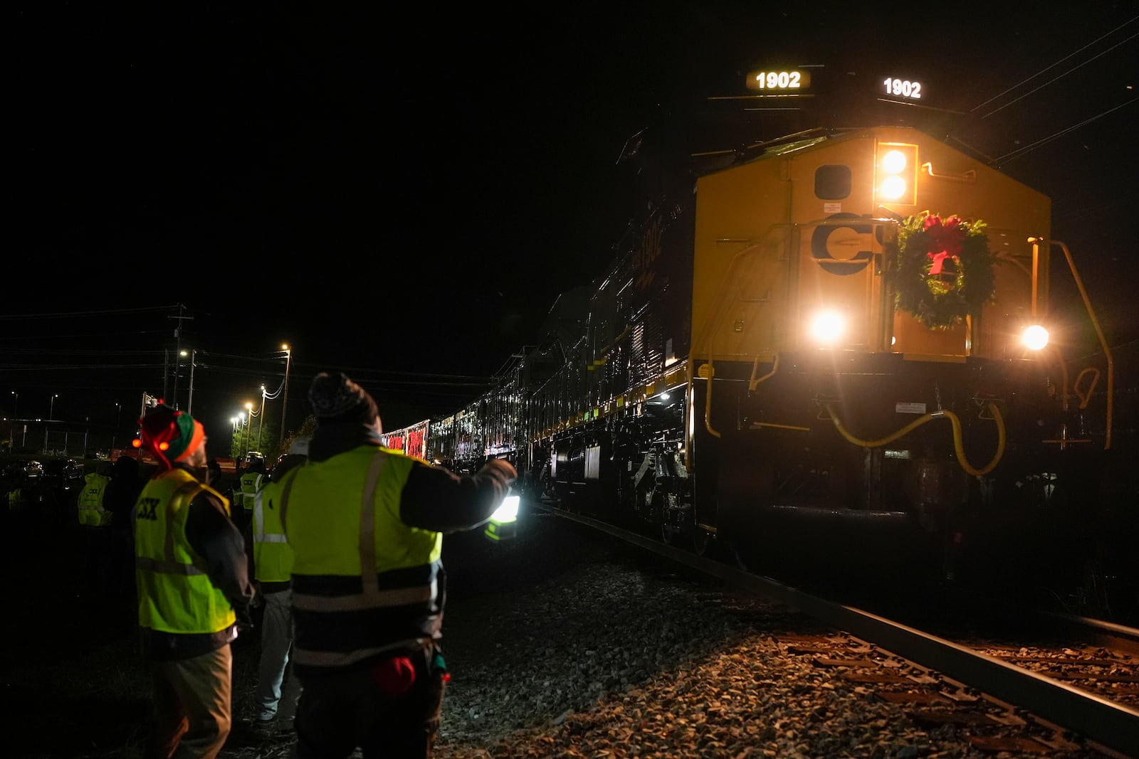 The CSX Holiday Express arrives, in Erwin, Tenn. Thursday, Nov. 21, 2024. The railway company held a celebration and concert for the town affected by Hurricane Helene. (AP Photo/George Walker IV)