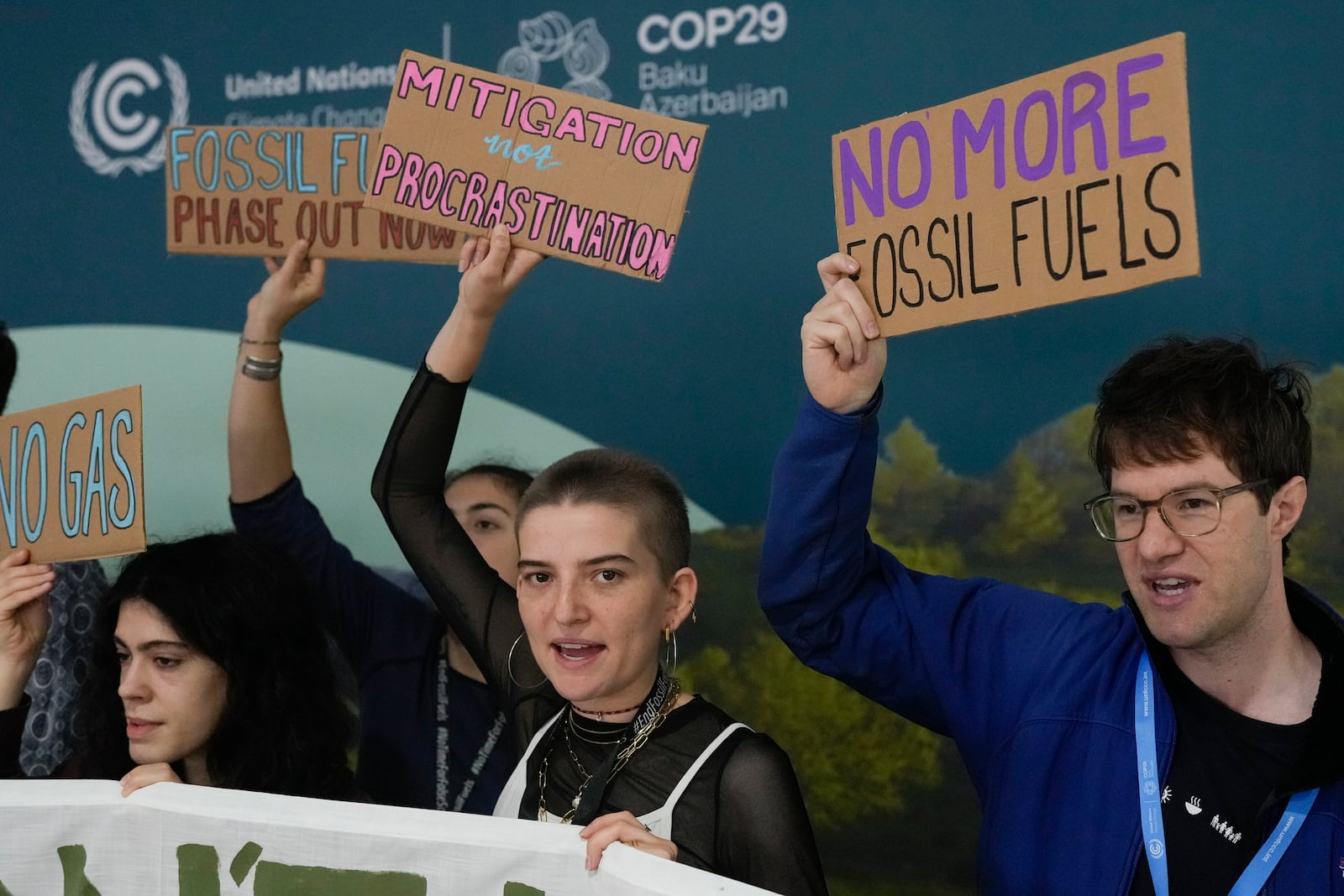 Activists participate in a demonstration against fossil fuels at the COP29 U.N. Climate Summit, Tuesday, Nov. 19, 2024, in Baku, Azerbaijan. (AP Photo/Rafiq Maqbool)