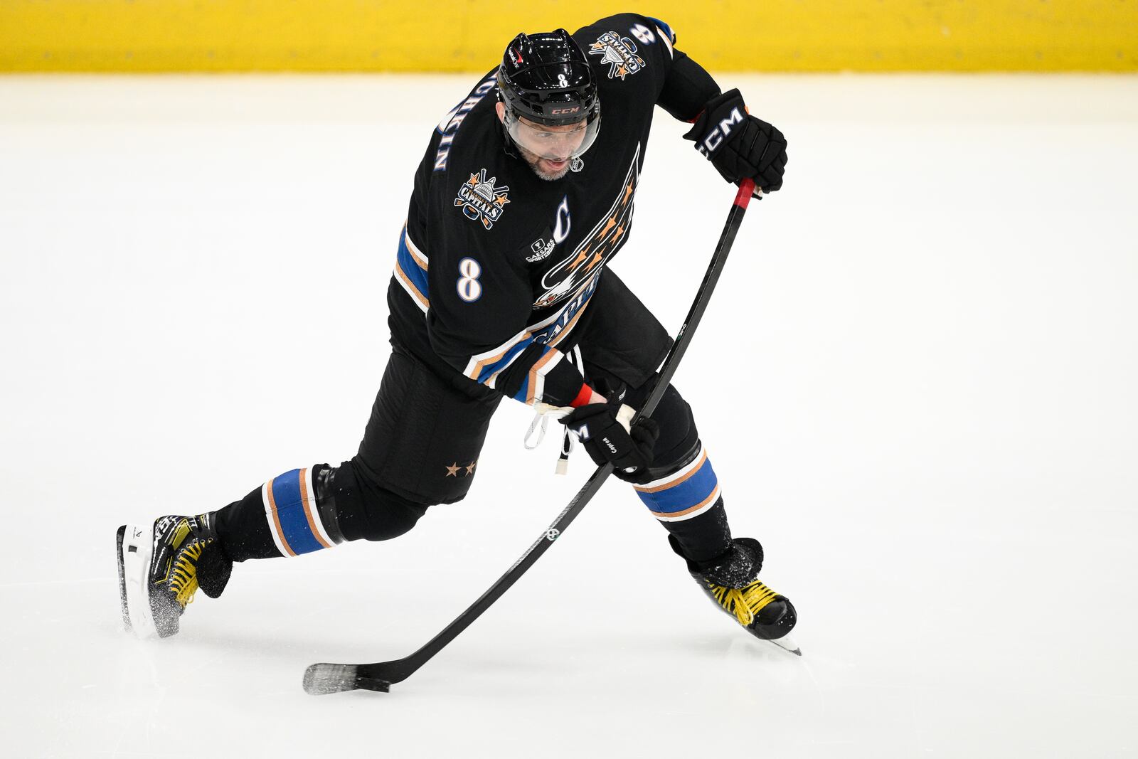 Washington Capitals left wing Alex Ovechkin (8) winds up for a shot during the third period of an NHL hockey game against the Pittsburgh Penguins, Saturday, Jan. 18, 2025, in Washington. (AP Photo/Nick Wass)