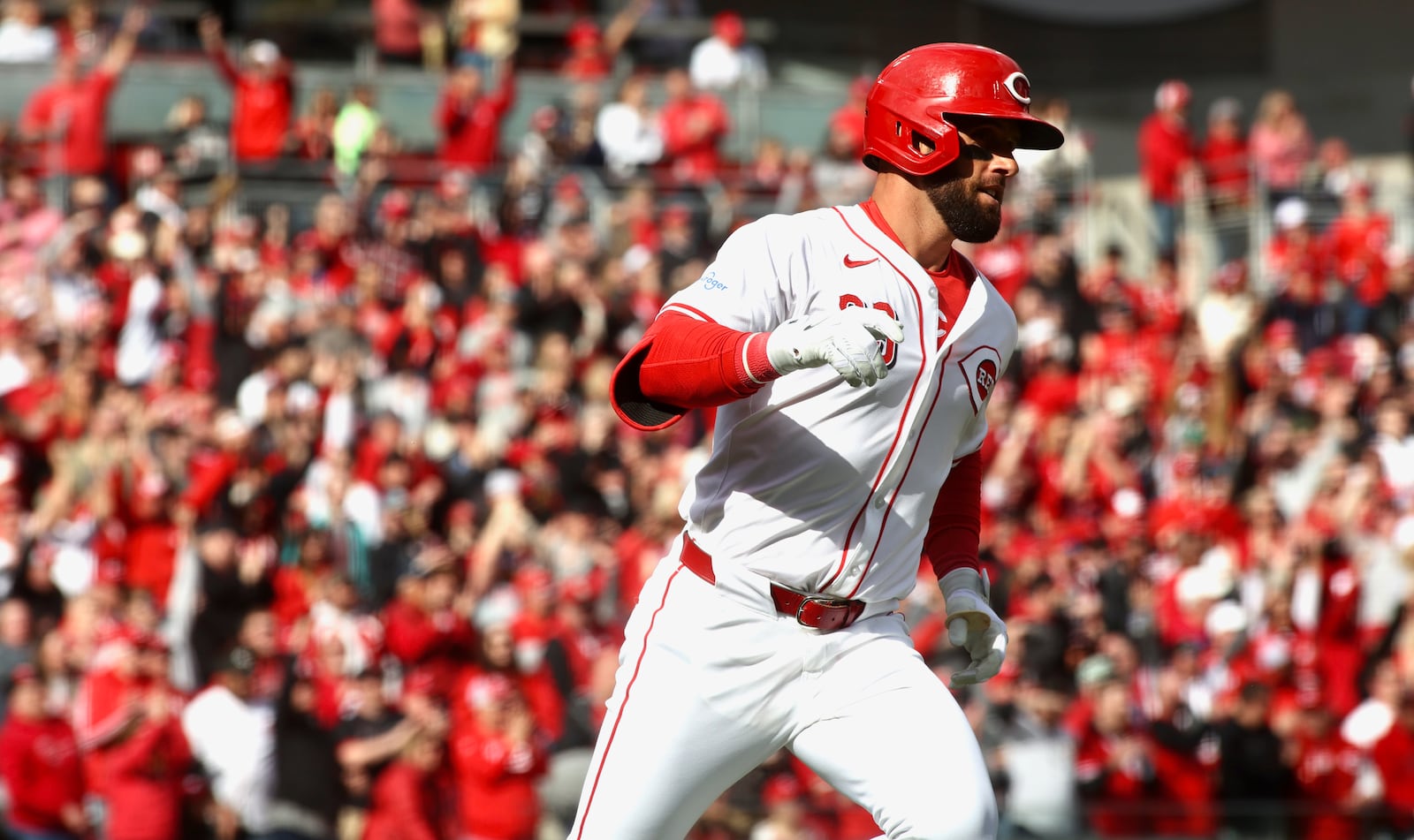 Nick Martini, of the Reds, rounds the bases after hitting a two-run home run in the second inning against the Nationals on Opening Day on Thursday, March 28, 2024, at Great American Ball Park in Cincinnati. David Jablonski/Staff