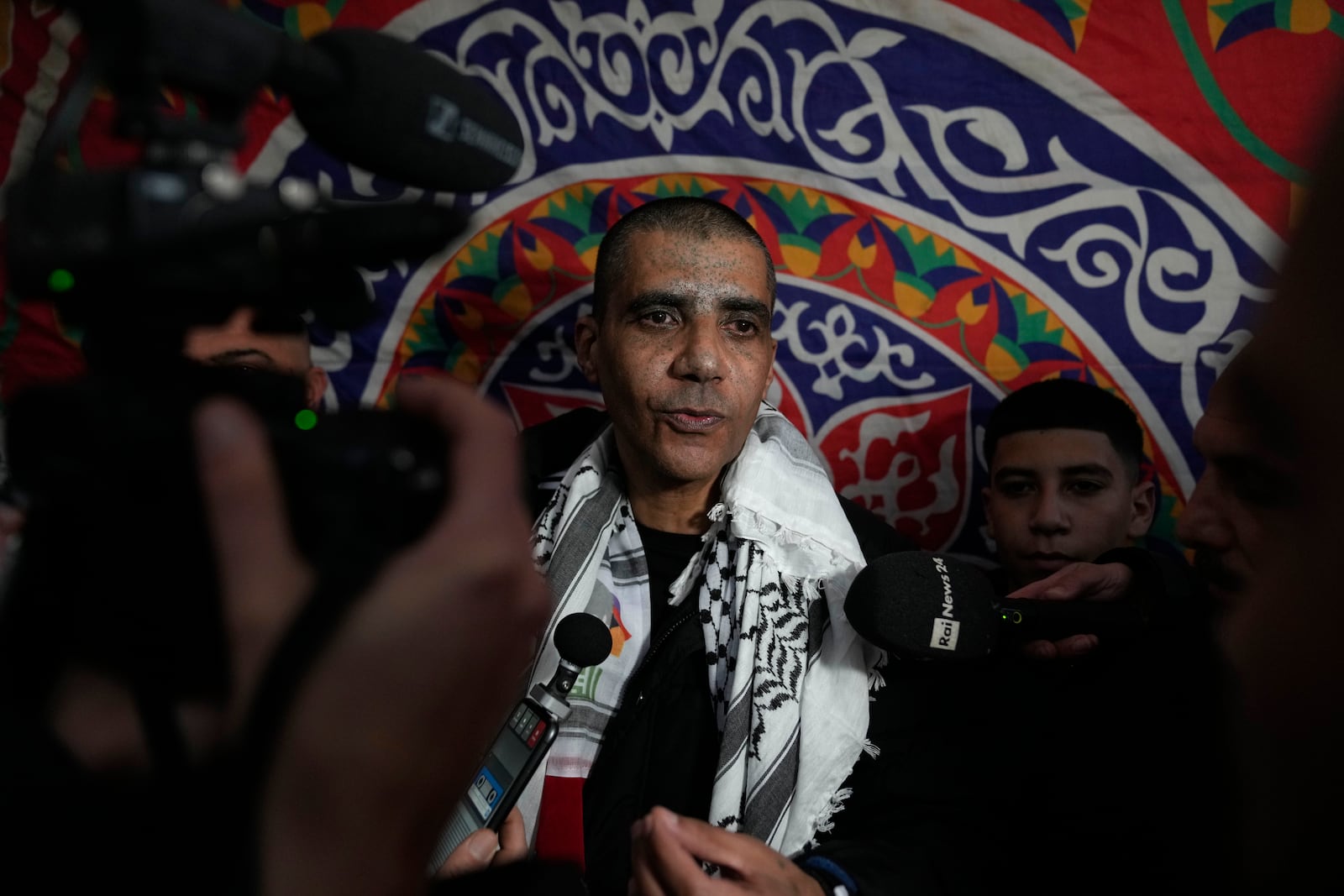 Released Palestinian prisoner and prominent former militant Zakaria Zubeidi talks to the media during a local reception ceremony in the West Bank city of Ramallah Friday, Jan. 31, 2025. (AP Photo/Nasser Nasser)