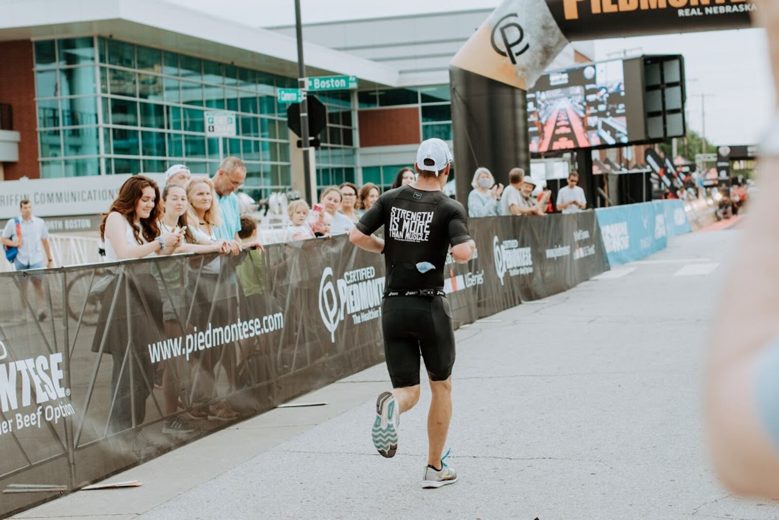 Brett Faro, Cedarville University soccer coach, wore the motto –  “Strength Is More Than Muscle” – on the back of his shirt as he competed in the 140.6 mile Tulsa Ironman last Sunday in Oklahoma to pay tribute his friend, 5-year-old Fritz Krieger, who is battling Duchenne muscular dystrophy, and was the inspiration for his grueling, 11-hour effort.  Shelley Faro Photography