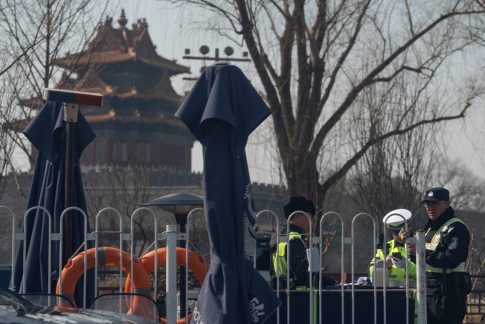 Chinese security personnel man a checkpoint around the Forbidden City area ahead of the National People's Congress in Beijing, on Feb. 28, 2025. (AP Photo/Ng Han Guan)