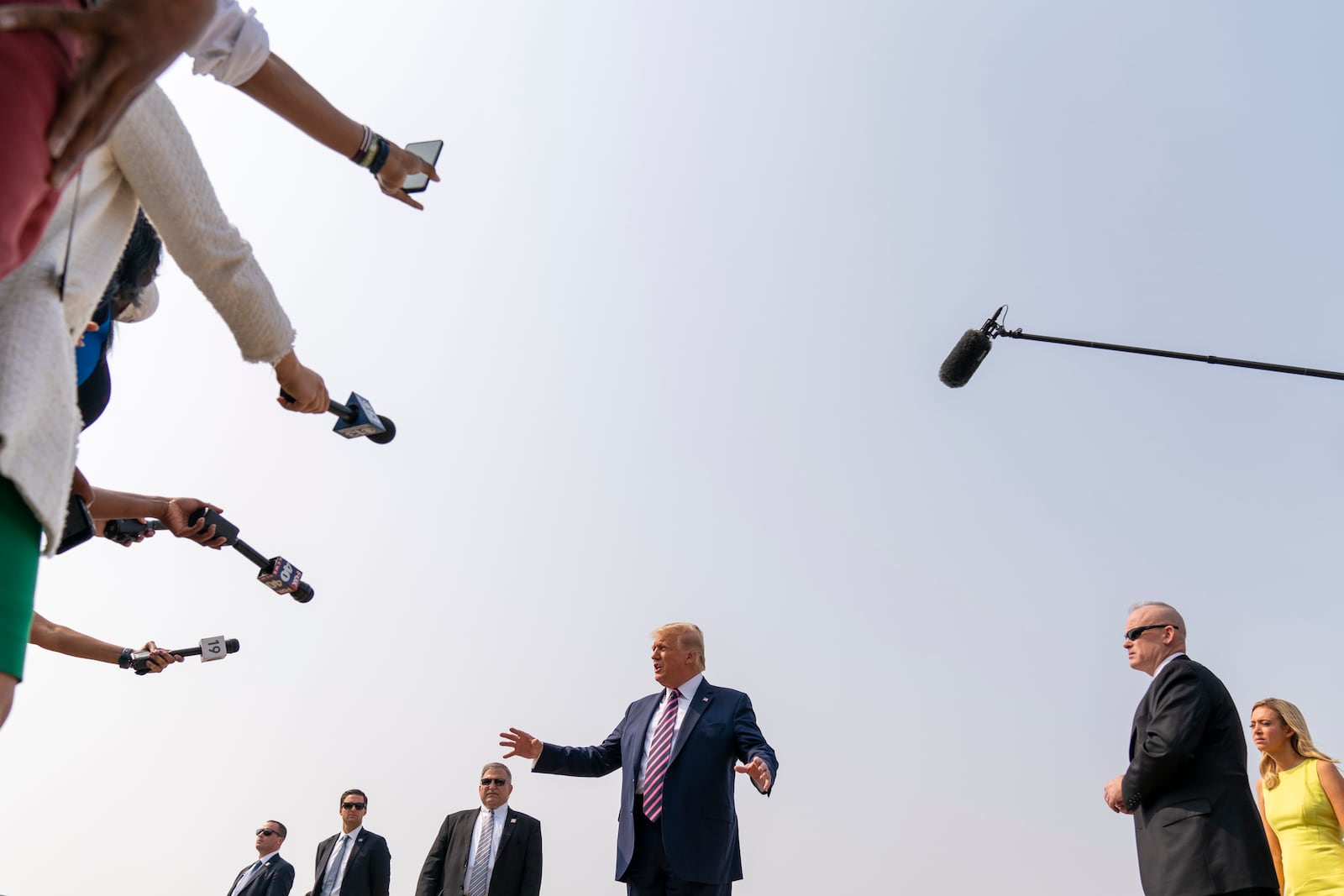 FILE - President Donald Trump speaks to reporters as he arrives at Sacramento McClellan Airport, in McClellan Park, Calif., Sept. 14, 2020. (AP Photo/Andrew Harnik, File)