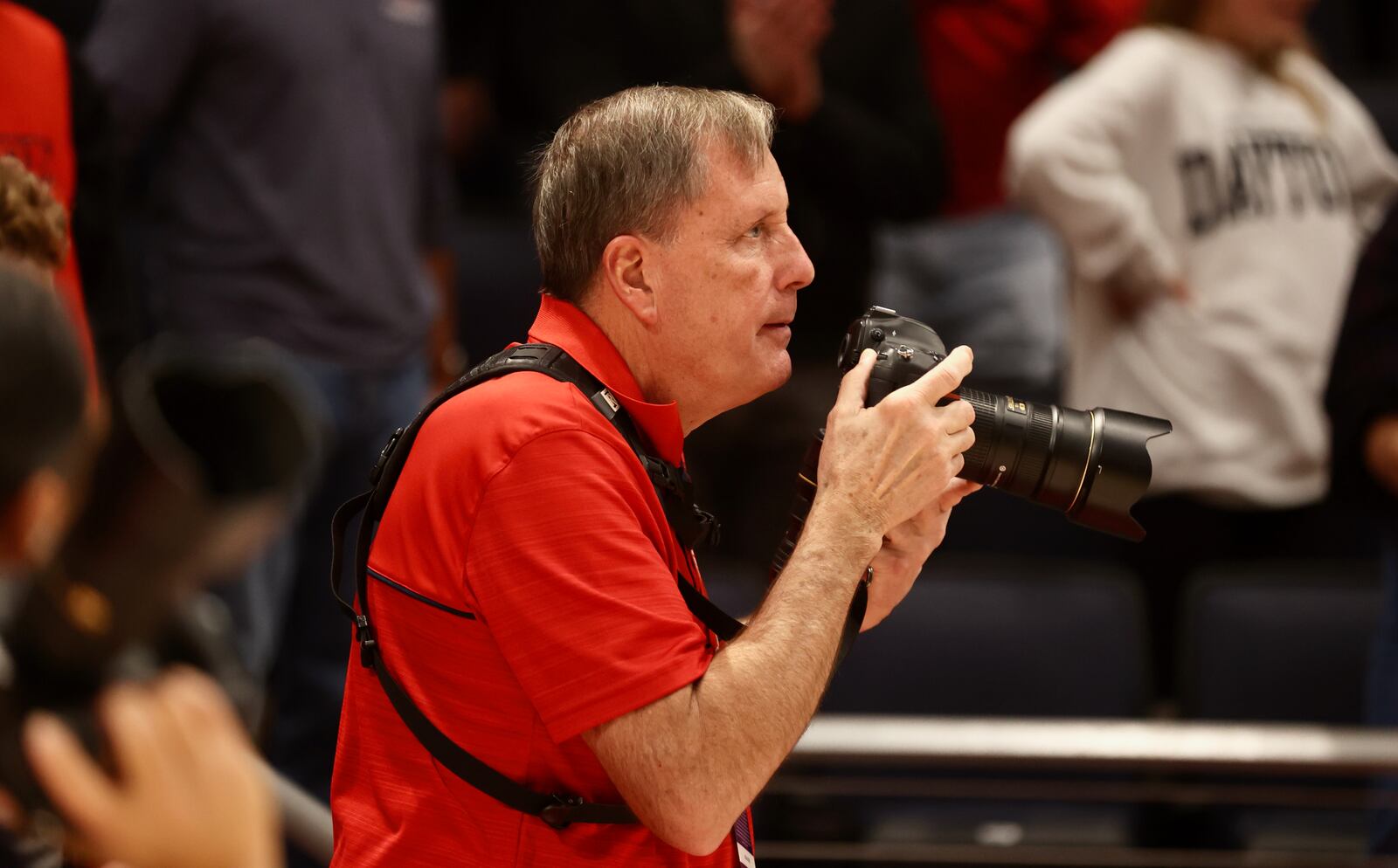 Rick Roshto photographs a Dayton basketball game at UD Arena on Dec. 28, 2022. David Jablonski/Staff