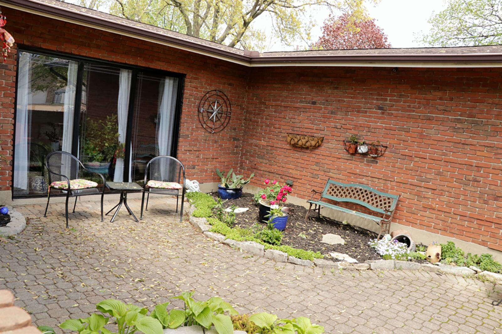 A second courtyard-like patio is nestled between the 4-season room and the recreation room within the back yard. The 4-season room is part of the main bedroom wing of the house. CONTRIBUTED PHOTO BY KATHY TYLER