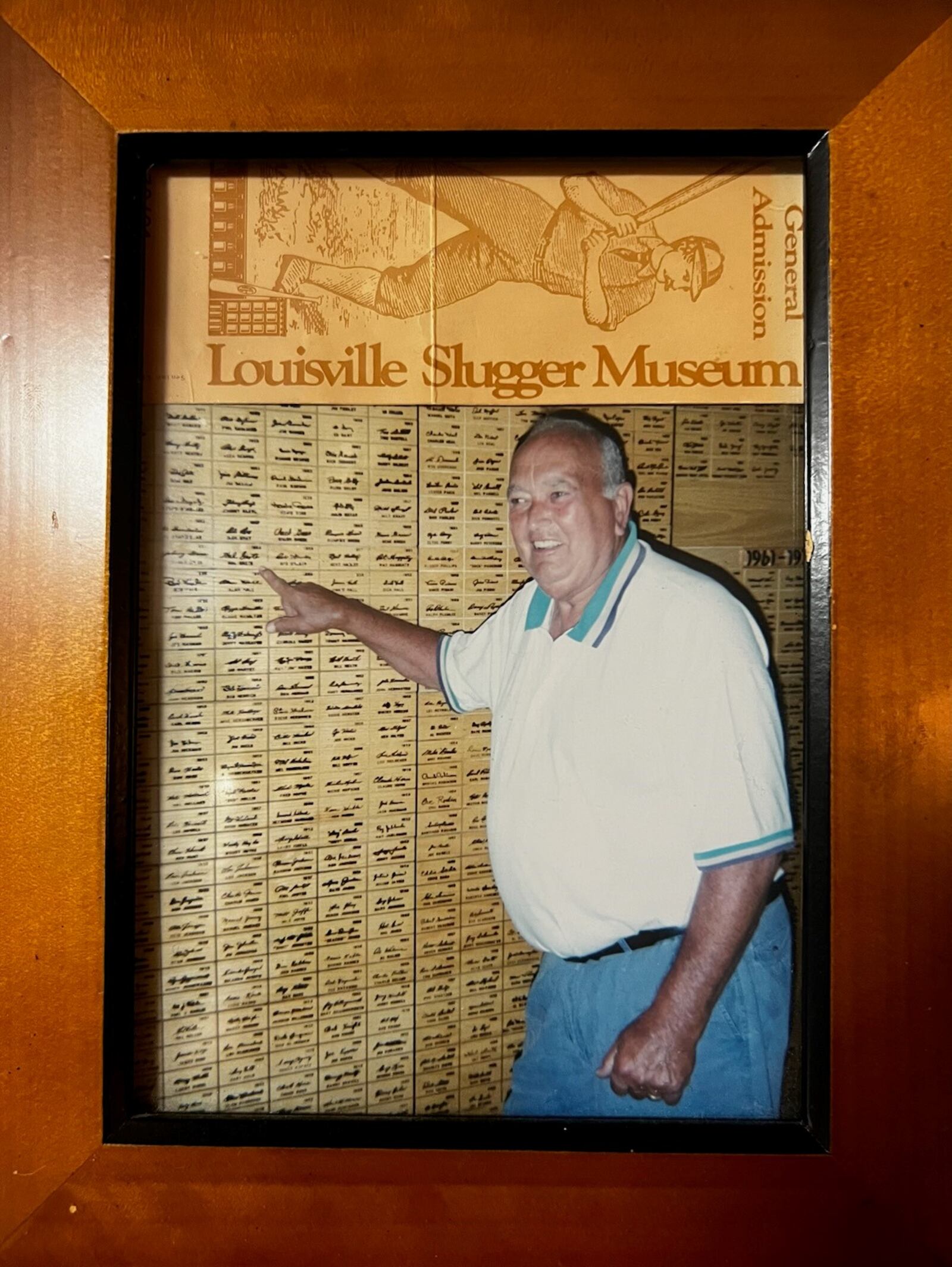 –  In a visit to the Louisville Slugger Museum in Louisville, Hal Grote points out his signature that was emblazoned on his bats in the 195Os. Once a speedy outfielder, he signed with the Brooklyn Dodgers out of high school and played 12 years – a total of 1,183 games – for minor league clubs across the nation in the Dodgers, New York Yankees and Boston Red Sox organizations. On the cusp of making the big leagues, he crashed into a centerfield wall making a catch and the injury cost him his advancement. He retired in 1960 and became a longtime postman in Cincinnati. His three sons – Bob, Steve and Mike – were each standout athletes as well. Hal Grote died in 2004 at age 74. CONTRIBUTED