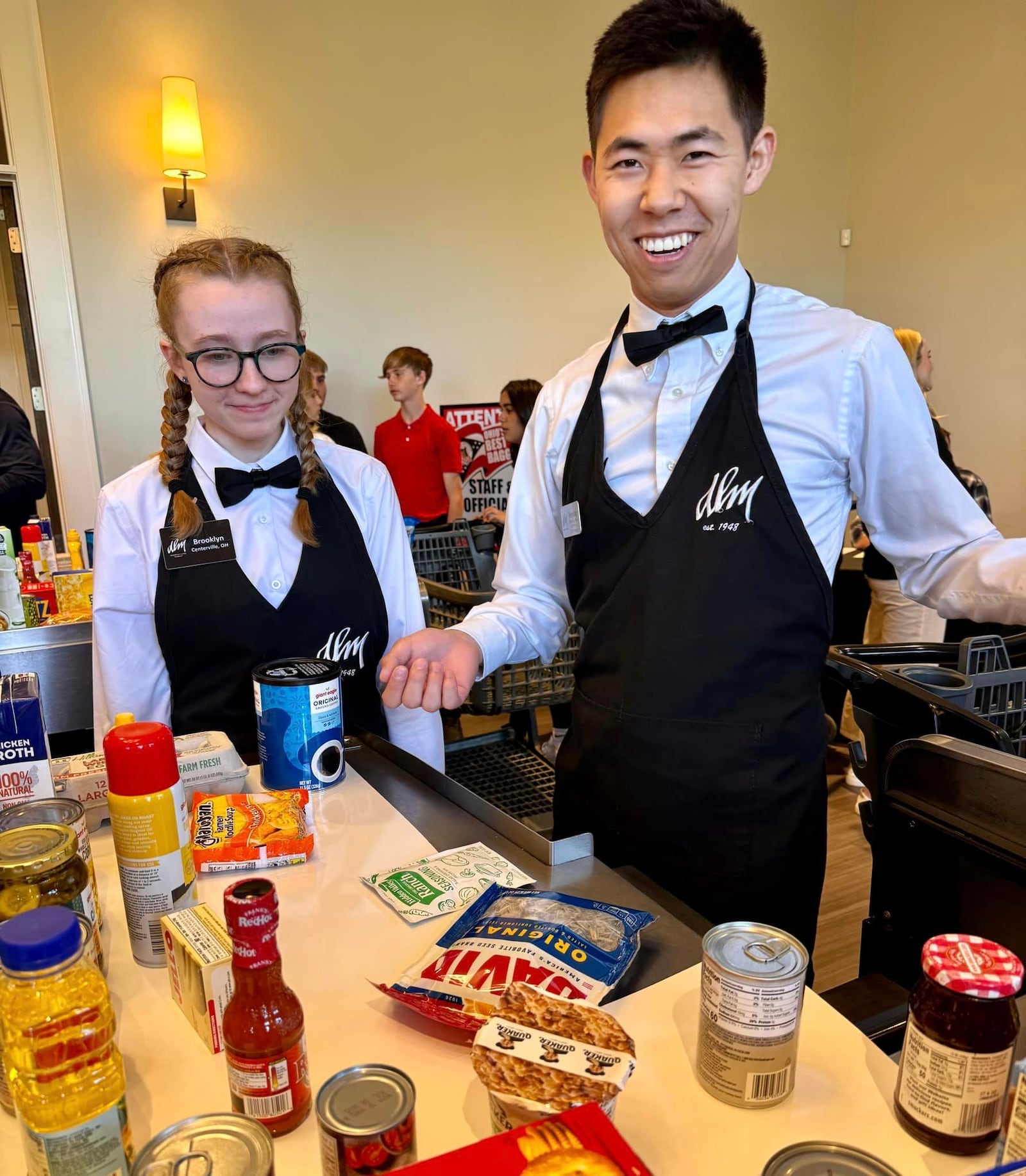 Three Dorothy Lane Market baggers swept away the top spots at the Ohio Grocers Association’s Best Bagger Competition. Pictured left to right is Brooklyn Asher (third place) and Fengning Liu (first place). FACEBOOK PHOTO