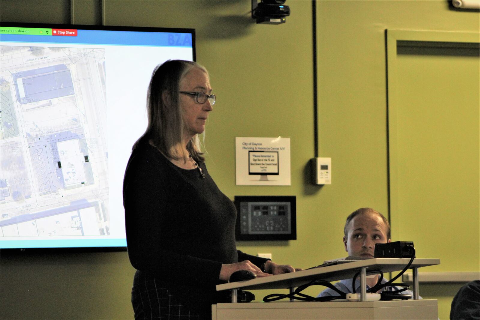 Karin Manovich, a South Park resident, speaks in opposition to a proposed crisis care center during a Dayton Board of Zoning Appeals meeting. CORNELIUS FROLIK / STAFF