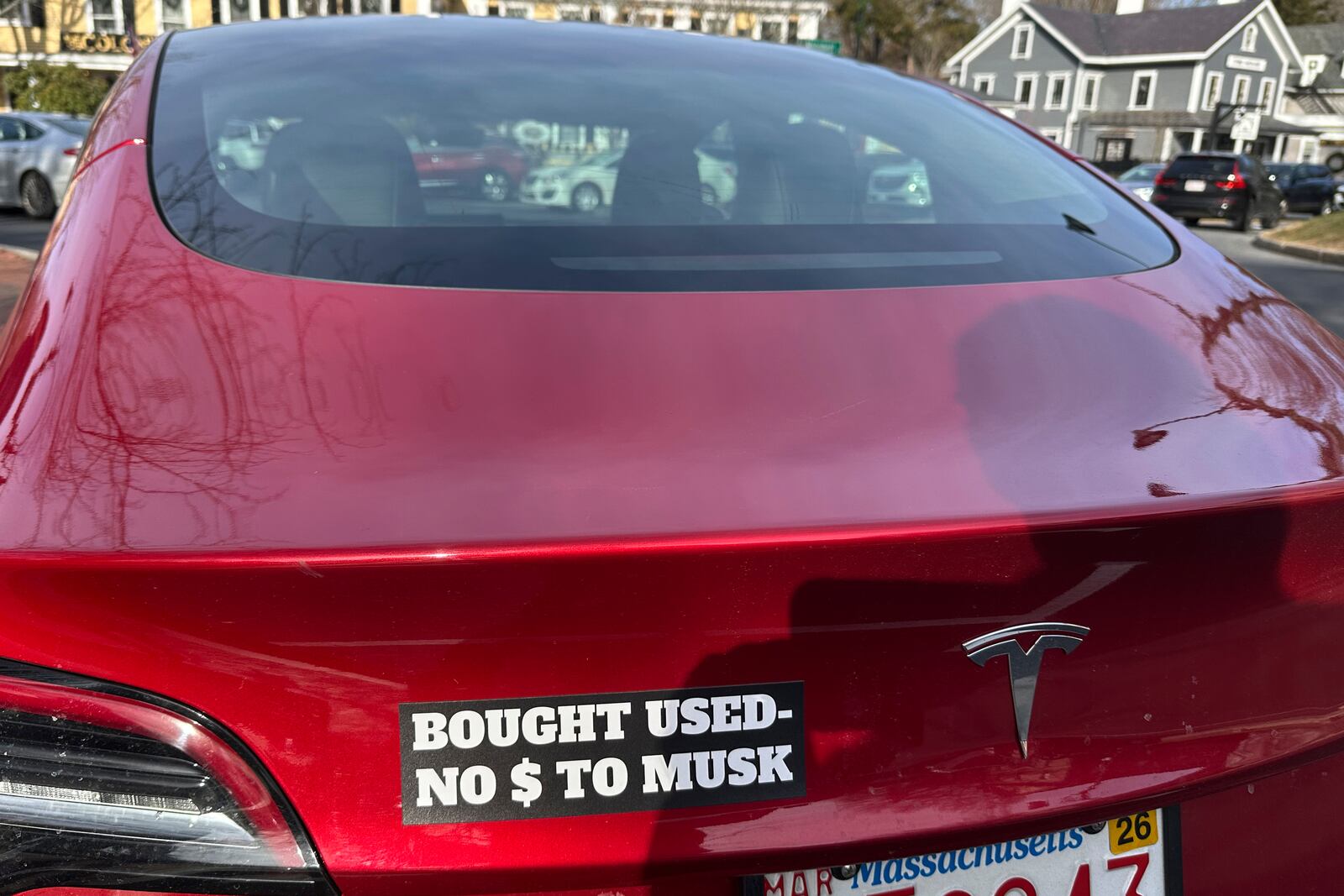 FILE - A Tesla with a sticker referring to the car's purchase is shown on Sunday, Dec. 15, 2024, in Concord, Mass. (AP Photo/Peter Morgan, File)