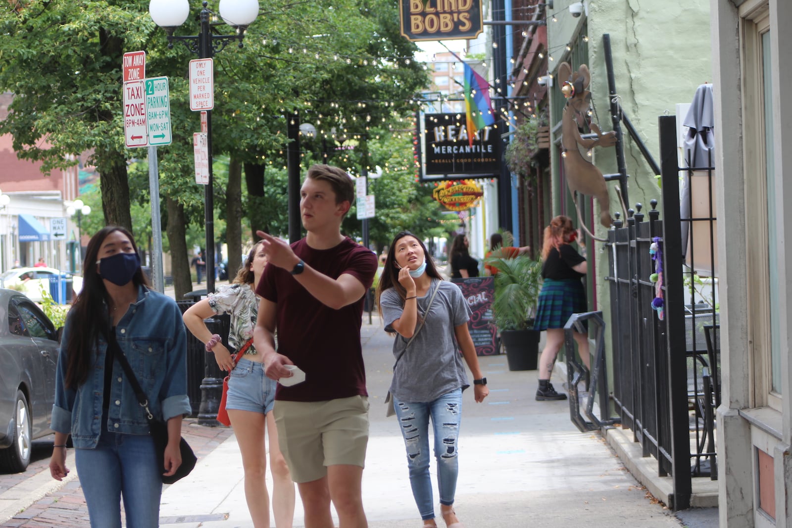 People stroll through the Oregon District on Saturday. CORNELIUS FROLIK / STAFF