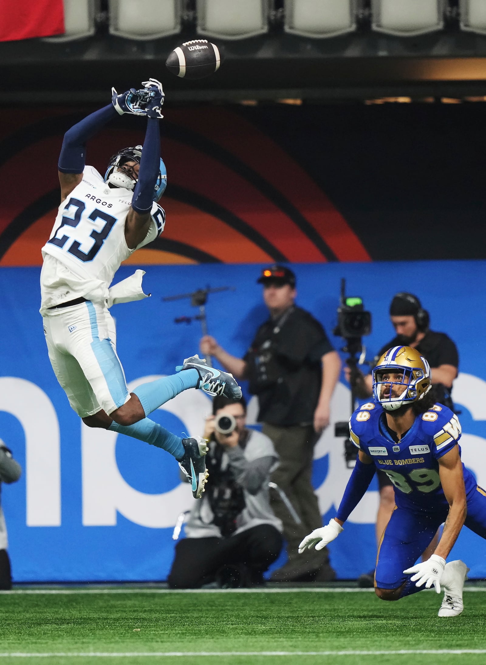 Toronto Argonauts' Benjie Franklin (23) can't make an interception on a pass intended for Winnipeg Blue Bombers' Kenny Lawler (89) during the second half of a CFL football game at the 111th Grey Cup in Vancouver, British Columbia, Sunday, Nov. 17, 2024. (Nathan Denette/The Canadian Press via AP)