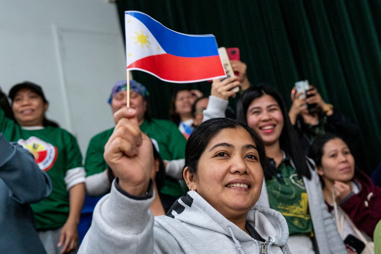 Supporters of former populist President of the Philippines Rodrigo Duterte cheer during a thanksgiving gathering organized by Hong Kong-based Filipino workers for him in Hong Kong on Sunday, March 9, 2025. (AP Photo/Vernon Yuen)