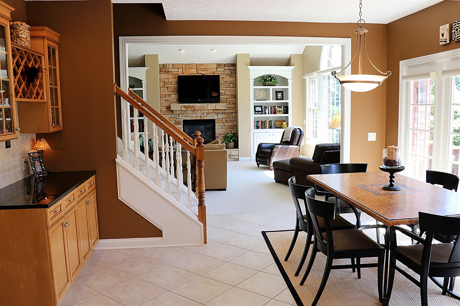 A semi-open staircase divides the breakfast room from the great room and provides a back access to the second floor. CONTRIBUTED PHOTO BY KATHY TYLER