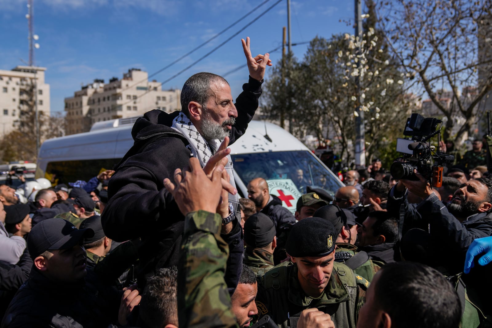 A Palestinian prisoner is greeted after being released from Israeli prison following a ceasefire agreement between Israel and Hamas, in the West Bank city of Ramallah, Saturday, Feb. 15, 2025. (AP Photo/Nasser Nasser)