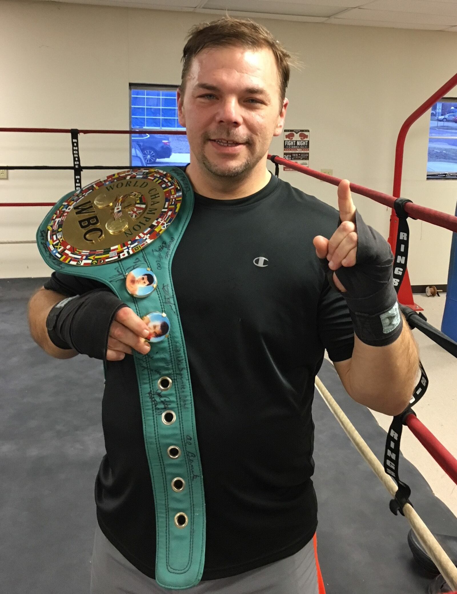 Richard Wilson, pictured here at the Brown Institute of Martial Arts in Centerville with Muhammad Ali's favorite title belt, which will be on display at Memorial Hall for Dayton Fight Night this Saturday Feb. 24, 2018.