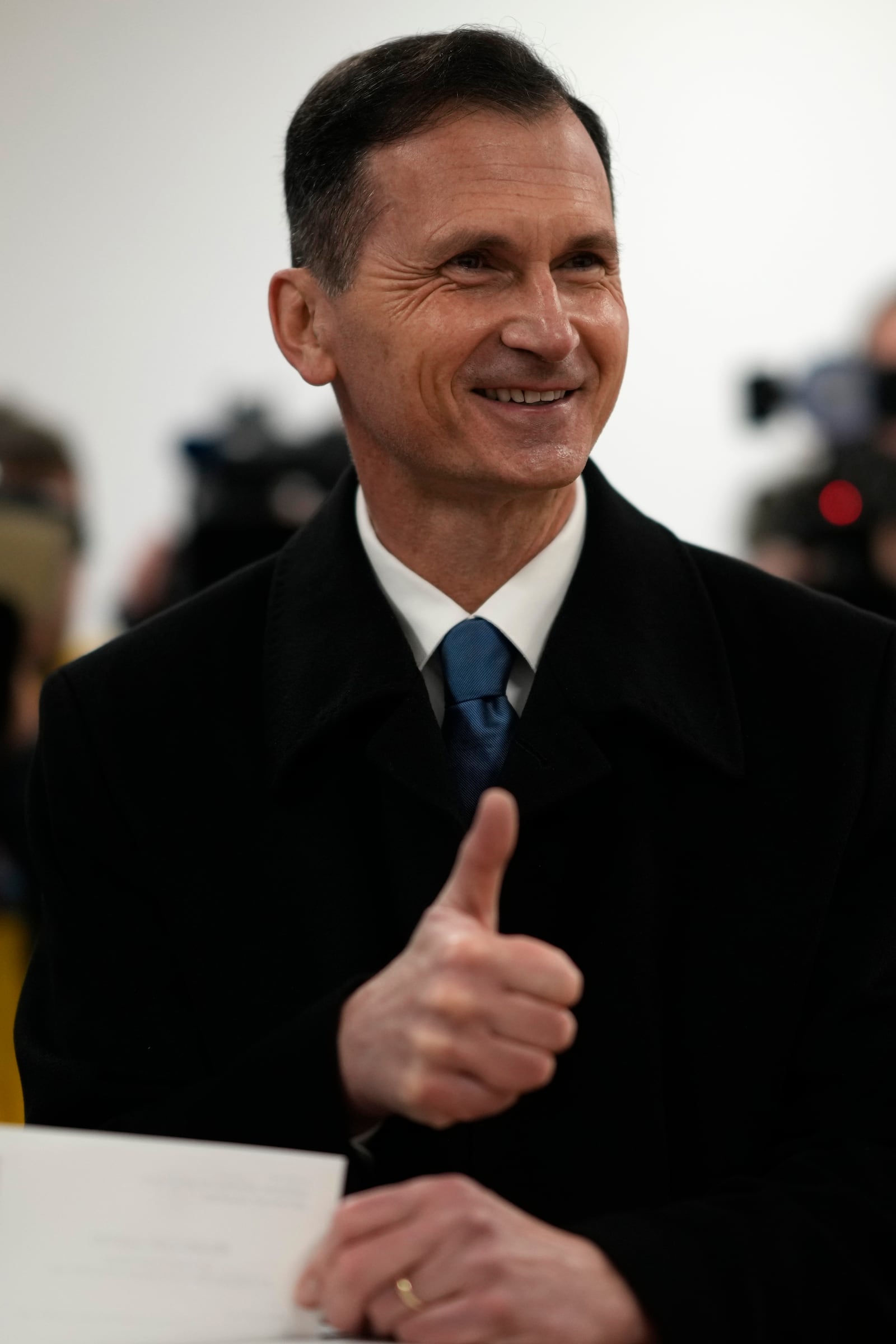 Presidential candidate Dragan Primorac arrives to cast his vote during a runoff vote for the Croatian presidential election at a polling station in Zagreb, Croatia, Sunday, Jan. 12, 2025. (AP Photo/Darko Bandic)