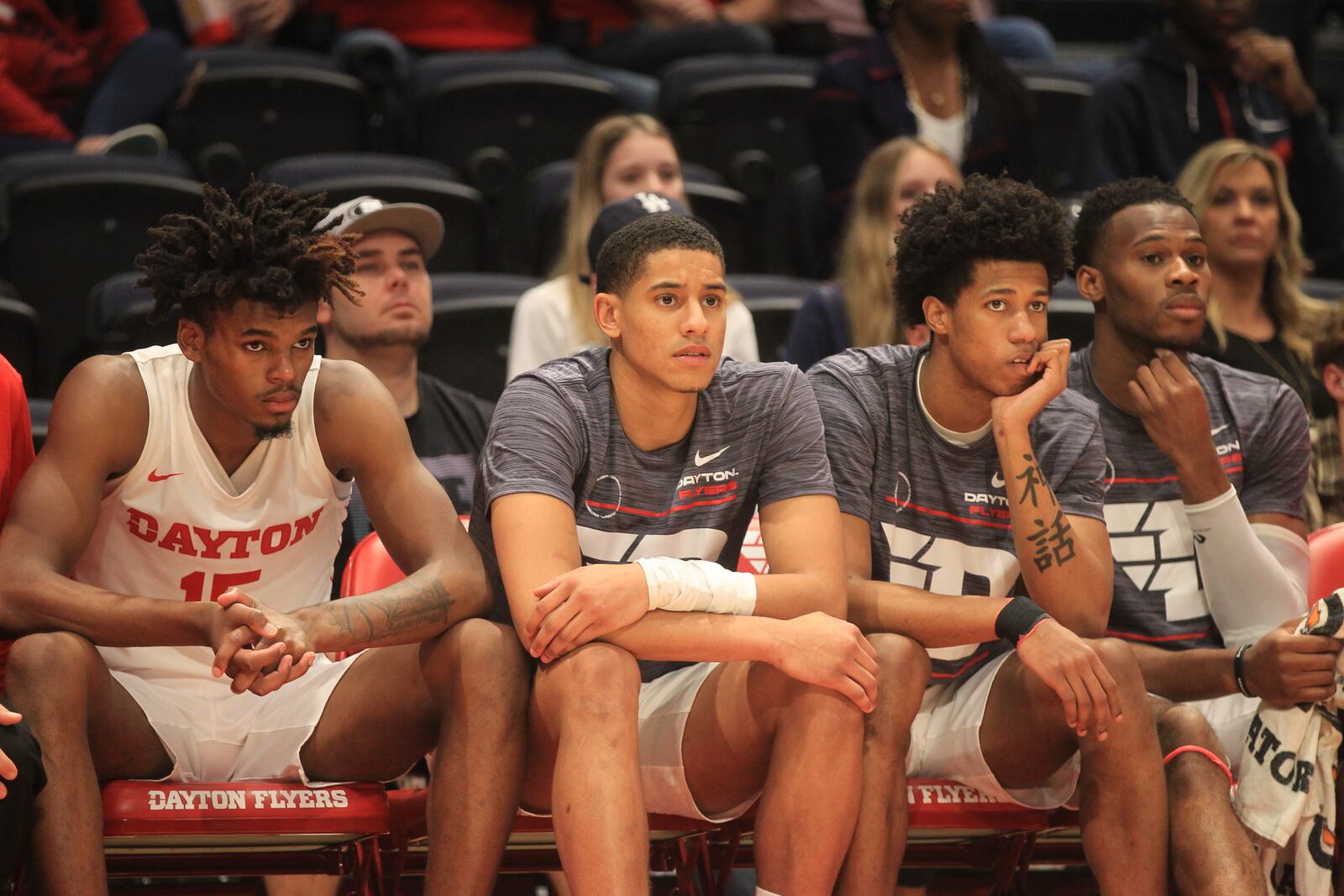 Dayton's DaRon Holmes II, Zimi Nwokeji, Kaleb Washington and Richard Amaefule watch the action during a game against Lipscomb ​on Wednesday, Nov. 17, 2021, at UD Arena. David Jablonski/Staf