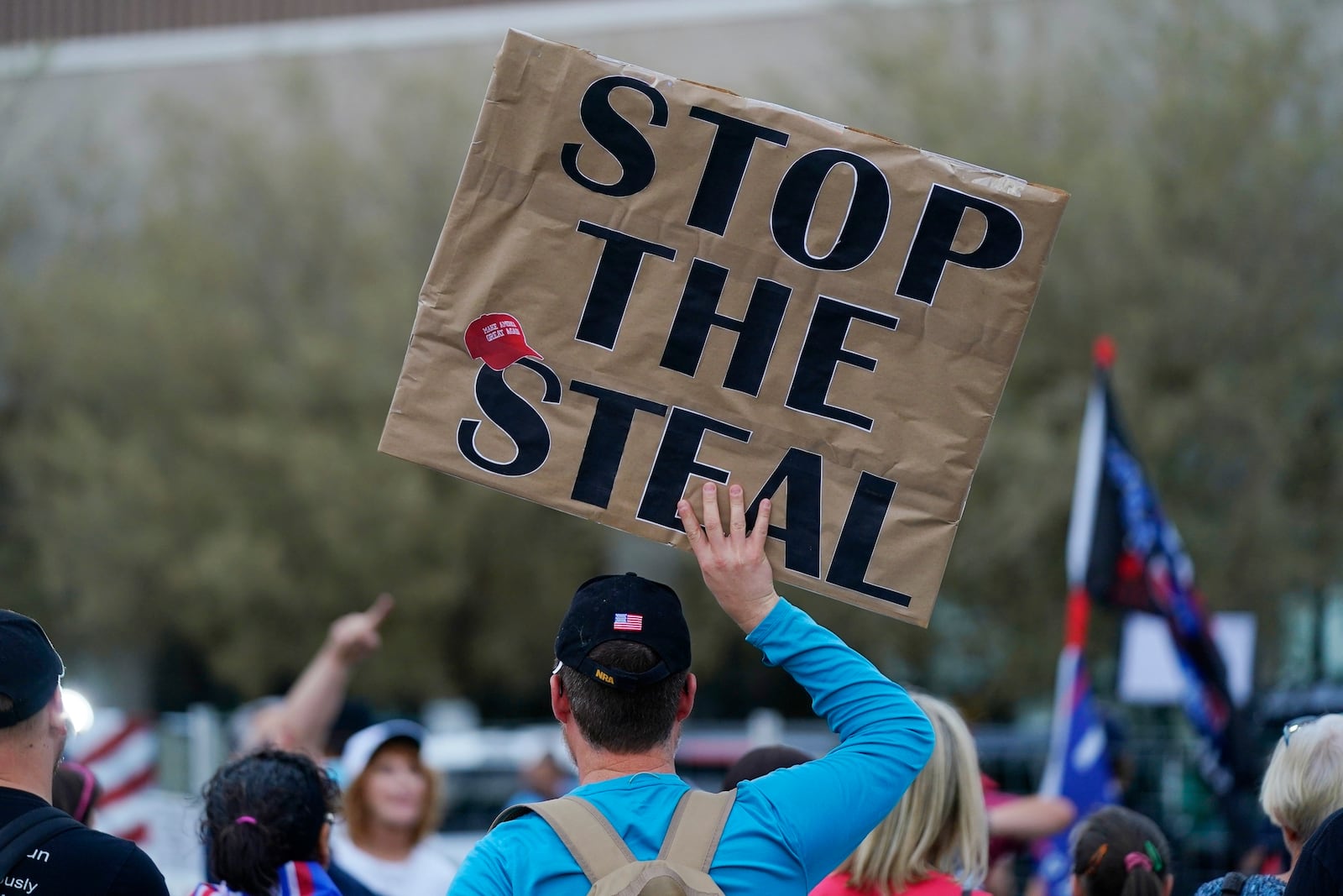 FILE - Supporters of President Donald Trump rally outside the Maricopa County Recorder's Office, Nov. 6, 2020, in Phoenix. (AP Photo/Ross D. Franklin, File)