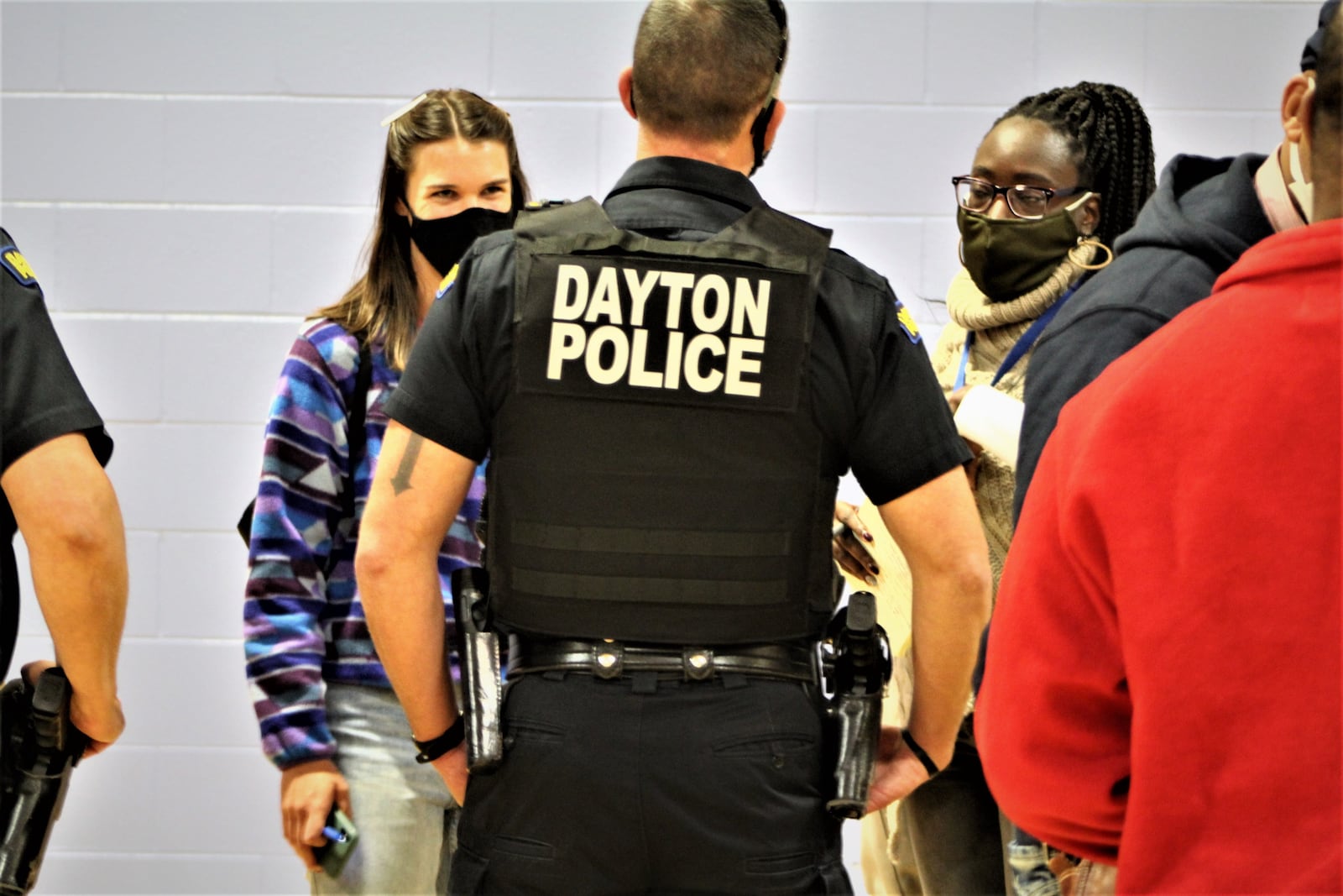 A Dayton police officer at a recent community input meeting in Dayton. CORNELIUS FROLIK / STAFF